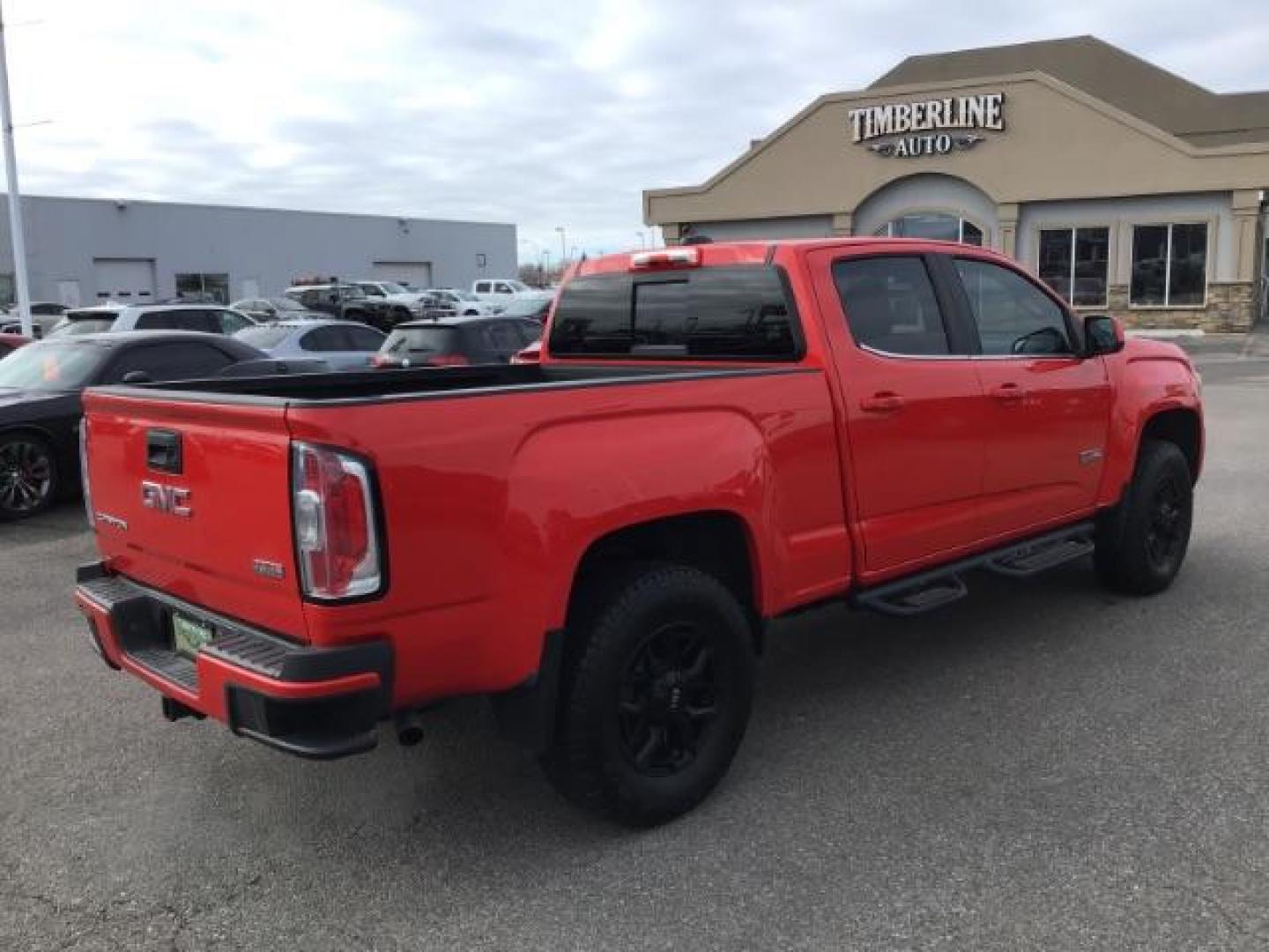 2015 Cardinal Red /Jet Black GMC Canyon SLE Crew Cab 4WD Short Box (1GTG6BE31F1) with an 3.6L V6 DOHC 24V engine, 6-Speed Automatic transmission, located at 1235 N Woodruff Ave., Idaho Falls, 83401, (208) 523-1053, 43.507172, -112.000488 - This 2015 GMC Canyon SLT 4x4, has 90,000 miles. Comes with leather interior, heated seats, Bose sound, back up camera, and spray in bed liner. At Timberline Auto it is always easy to find a great deal on your next vehicle! Our experienced sales staff can help find the right vehicle that will fit you - Photo#4