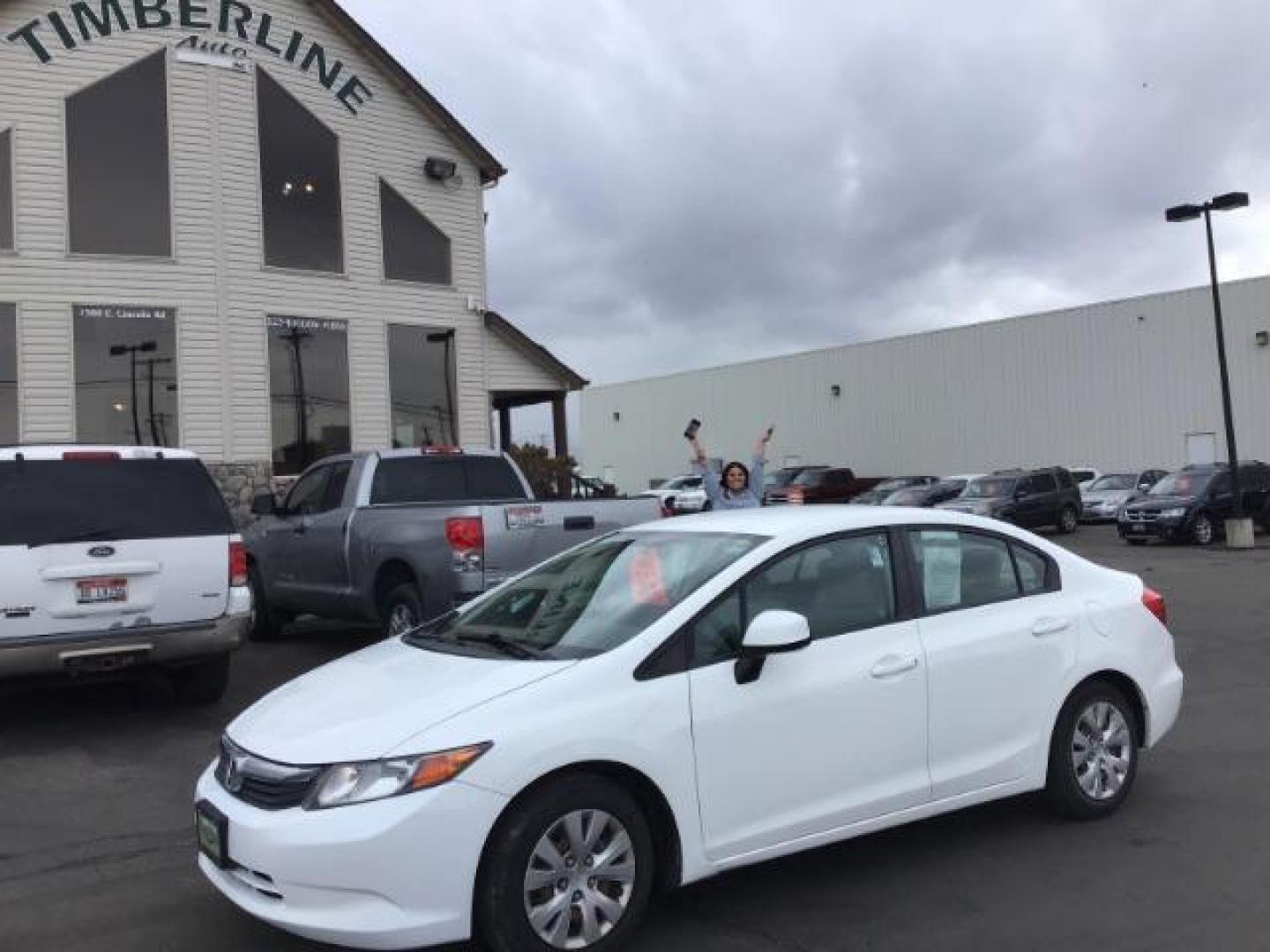 2012 Taffeta White /Gray Cloth Interior Honda Civic LX Sedan 5-Speed AT (19XFB2F54CE) with an 1.8L L4 SOHC 16V engine, 5-Speed Automatic transmission, located at 1235 N Woodruff Ave., Idaho Falls, 83401, (208) 523-1053, 43.507172, -112.000488 - This 2012 Honda Civic LX, has 98,000 miles. Comes with cloth interior, cruise control, power windows and locks, and AM/FM CD stereo. At Timberline Auto it is always easy to find a great deal on your next vehicle! Our experienced sales staff can help find the right vehicle will fit your needs. Our kn - Photo#0