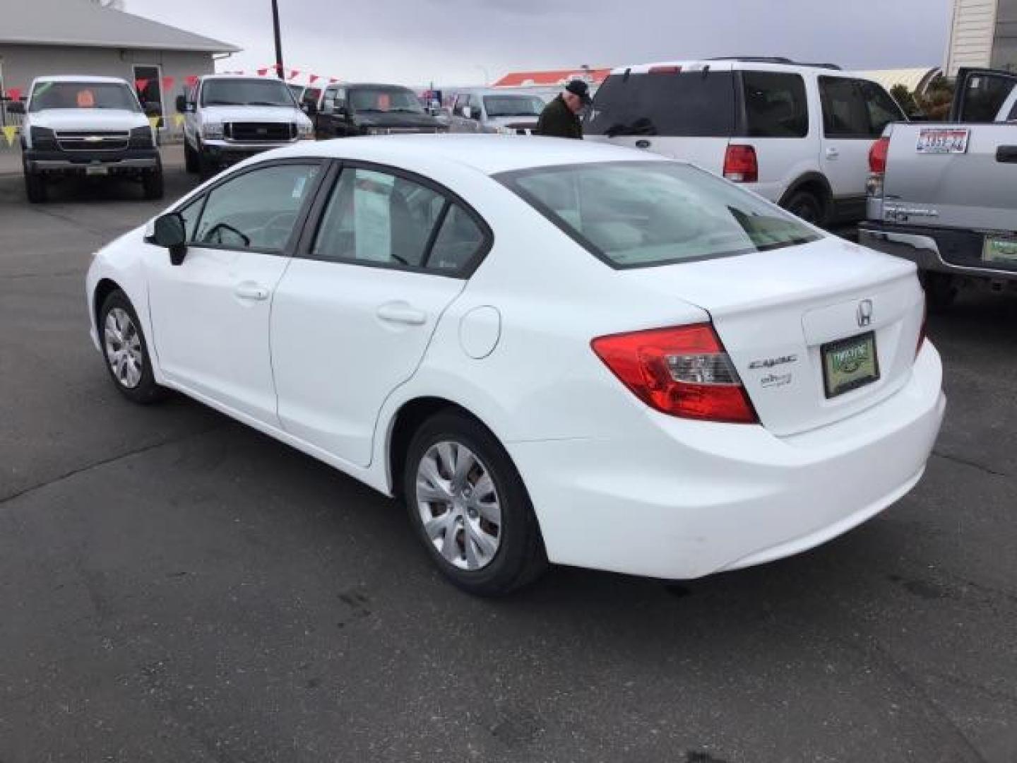 2012 Taffeta White /Gray Cloth Interior Honda Civic LX Sedan 5-Speed AT (19XFB2F54CE) with an 1.8L L4 SOHC 16V engine, 5-Speed Automatic transmission, located at 1235 N Woodruff Ave., Idaho Falls, 83401, (208) 523-1053, 43.507172, -112.000488 - This 2012 Honda Civic LX, has 98,000 miles. Comes with cloth interior, cruise control, power windows and locks, and AM/FM CD stereo. At Timberline Auto it is always easy to find a great deal on your next vehicle! Our experienced sales staff can help find the right vehicle will fit your needs. Our kn - Photo#2