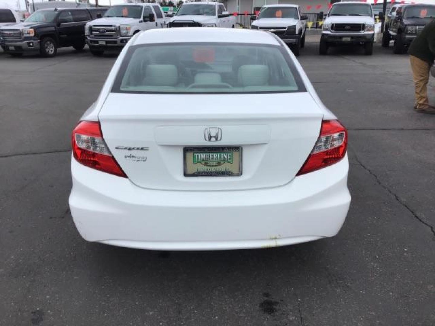 2012 Taffeta White /Gray Cloth Interior Honda Civic LX Sedan 5-Speed AT (19XFB2F54CE) with an 1.8L L4 SOHC 16V engine, 5-Speed Automatic transmission, located at 1235 N Woodruff Ave., Idaho Falls, 83401, (208) 523-1053, 43.507172, -112.000488 - This 2012 Honda Civic LX, has 98,000 miles. Comes with cloth interior, cruise control, power windows and locks, and AM/FM CD stereo. At Timberline Auto it is always easy to find a great deal on your next vehicle! Our experienced sales staff can help find the right vehicle will fit your needs. Our kn - Photo#3