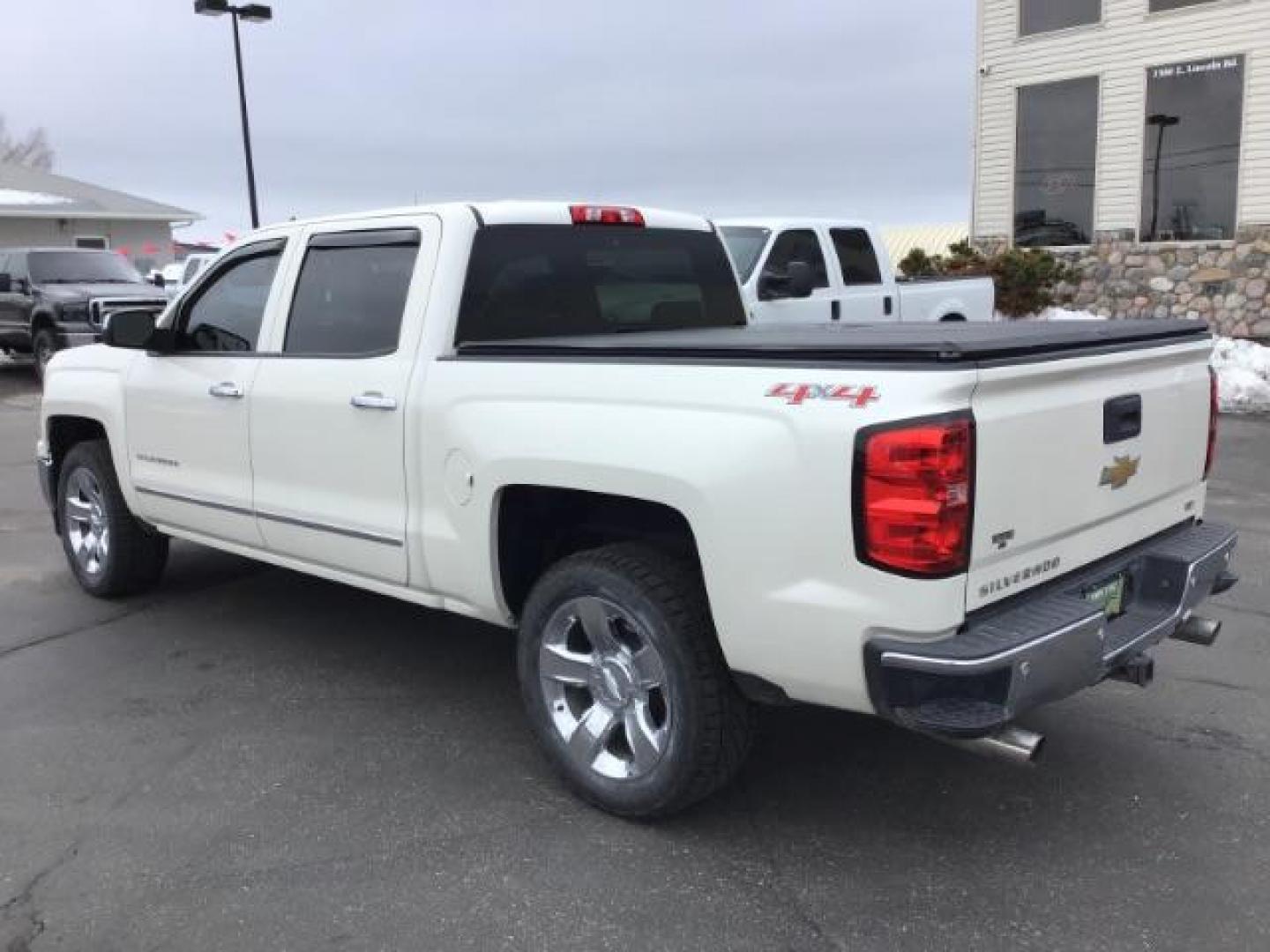 2014 White Diamond Tricoat /Jet Black Chevrolet Silverado 1500 LTZ CREWCAB (3GCUKSEC2EG) with an 5.3L V8 OHV 16V engine, 6-Speed Automatic transmission, located at 1235 N Woodruff Ave., Idaho Falls, 83401, (208) 523-1053, 43.507172, -112.000488 - This 2014 Chevrolet 1500 LTZ 4x4, has the 5.3L motor. It has 117,000 miles. It comes with leather interior, heated seats, blue tooth audio, back up camera, Bose sound system, power seats, and power windows and locks. At Timberline Auto it is always easy to find a great deal on your next vehicle! Our - Photo#2