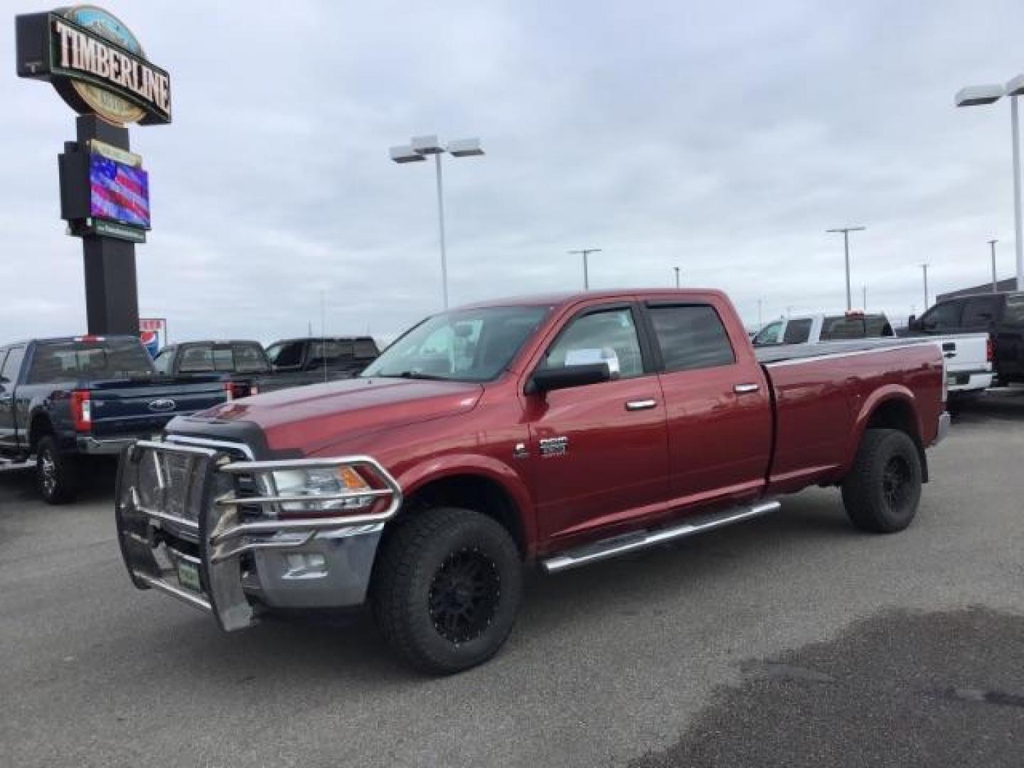 2012 Flame Red /Dark Slate Leather Interior RAM 2500 Laramie Crew Cab LWB 4WD (3C6UD5KLXCG) with an 6.7L L6 OHV 24V TURBO DIESEL engine, MANUAL transmission, located at 1235 N Woodruff Ave., Idaho Falls, 83401, (208) 523-1053, 43.507172, -112.000488 - This 2012 Ram 2500 Laramie, has the 6.7L diesel. It has a manual transmission. It has 118,000 miles. It is a local trade in. It comes with leather interior, heated seats, dual power seats, power lock and windows. At Timberline Auto it is always easy to find a great deal on your next vehicle! Our e - Photo#0