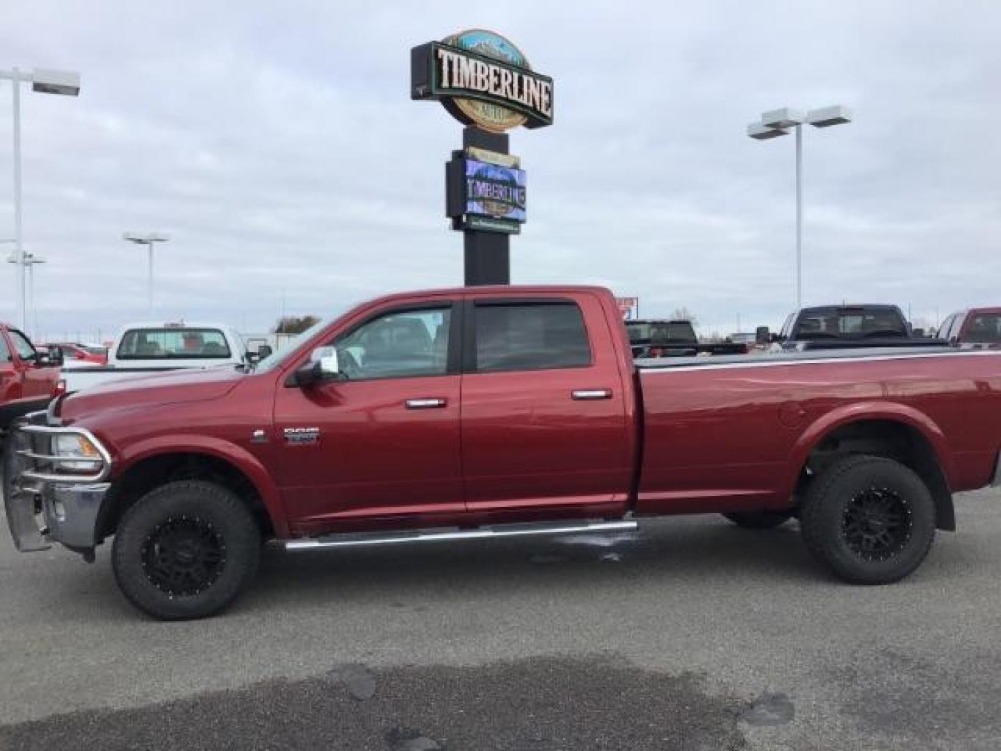 2012 Flame Red /Dark Slate Leather Interior RAM 2500 Laramie Crew Cab LWB 4WD (3C6UD5KLXCG) with an 6.7L L6 OHV 24V TURBO DIESEL engine, MANUAL transmission, located at 1235 N Woodruff Ave., Idaho Falls, 83401, (208) 523-1053, 43.507172, -112.000488 - This 2012 Ram 2500 Laramie, has the 6.7L diesel. It has a manual transmission. It has 118,000 miles. It is a local trade in. It comes with leather interior, heated seats, dual power seats, power lock and windows. At Timberline Auto it is always easy to find a great deal on your next vehicle! Our e - Photo#1