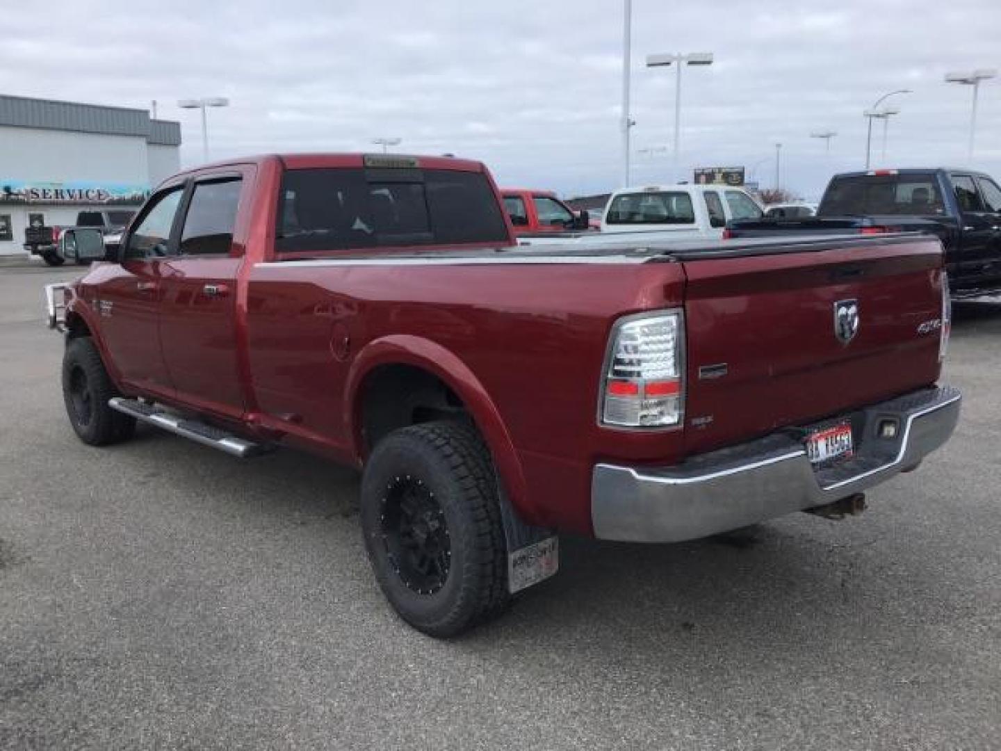 2012 Flame Red /Dark Slate Leather Interior RAM 2500 Laramie Crew Cab LWB 4WD (3C6UD5KLXCG) with an 6.7L L6 OHV 24V TURBO DIESEL engine, MANUAL transmission, located at 1235 N Woodruff Ave., Idaho Falls, 83401, (208) 523-1053, 43.507172, -112.000488 - This 2012 Ram 2500 Laramie, has the 6.7L diesel. It has a manual transmission. It has 118,000 miles. It is a local trade in. It comes with leather interior, heated seats, dual power seats, power lock and windows. At Timberline Auto it is always easy to find a great deal on your next vehicle! Our e - Photo#2