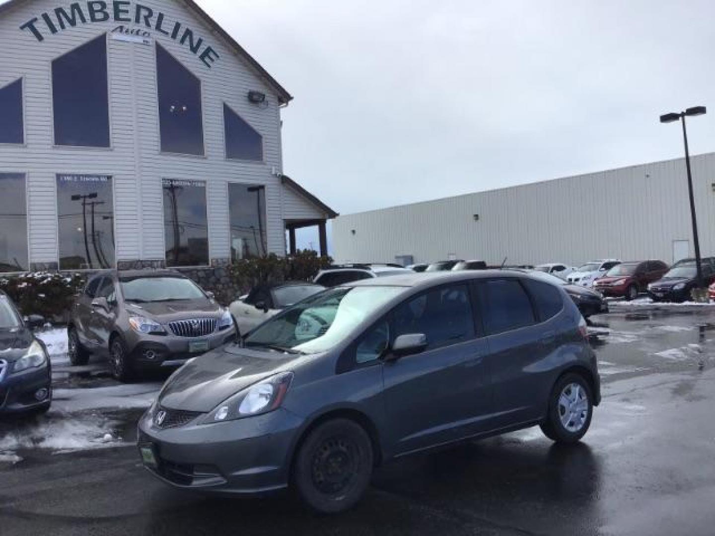 2013 GRAY /Gray Cloth Interior Honda Fit 5-Speed AT (JHMGE8H34DC) with an 1.5L L4 SOHC 16V engine, 5-Speed Automatic transmission, located at 1235 N Woodruff Ave., Idaho Falls, 83401, (208) 523-1053, 43.507172, -112.000488 - This 2013 Honda Fit, has 210,000 miles. It comes with cloth interior, cruise control, power windows, and locks. At Timberline Auto it is always easy to find a great deal on your next vehicle! Our experienced sales staff can help find the right vehicle will fit your needs. Our knowledgeable finance d - Photo#0