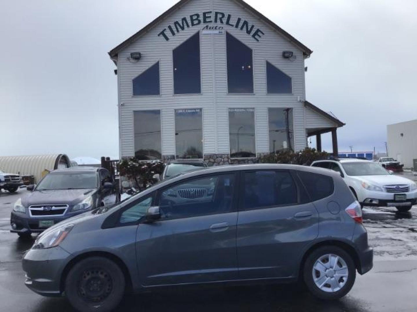 2013 GRAY /Gray Cloth Interior Honda Fit 5-Speed AT (JHMGE8H34DC) with an 1.5L L4 SOHC 16V engine, 5-Speed Automatic transmission, located at 1235 N Woodruff Ave., Idaho Falls, 83401, (208) 523-1053, 43.507172, -112.000488 - This 2013 Honda Fit, has 210,000 miles. It comes with cloth interior, cruise control, power windows, and locks. At Timberline Auto it is always easy to find a great deal on your next vehicle! Our experienced sales staff can help find the right vehicle will fit your needs. Our knowledgeable finance d - Photo#1