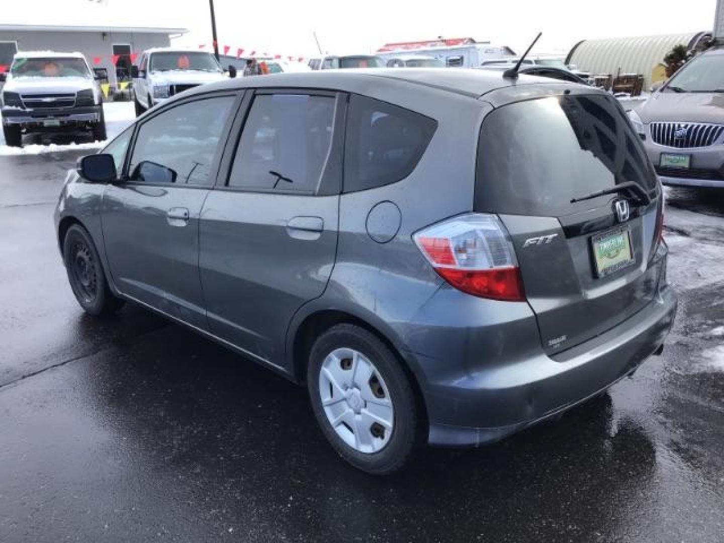 2013 GRAY /Gray Cloth Interior Honda Fit 5-Speed AT (JHMGE8H34DC) with an 1.5L L4 SOHC 16V engine, 5-Speed Automatic transmission, located at 1235 N Woodruff Ave., Idaho Falls, 83401, (208) 523-1053, 43.507172, -112.000488 - This 2013 Honda Fit, has 210,000 miles. It comes with cloth interior, cruise control, power windows, and locks. At Timberline Auto it is always easy to find a great deal on your next vehicle! Our experienced sales staff can help find the right vehicle will fit your needs. Our knowledgeable finance d - Photo#2