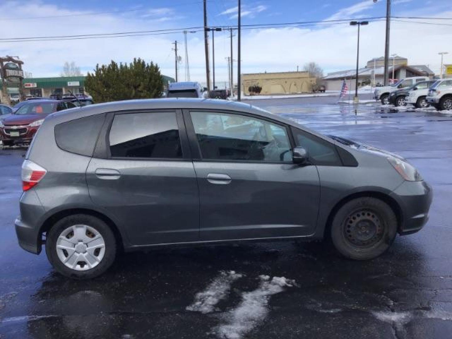 2013 GRAY /Gray Cloth Interior Honda Fit 5-Speed AT (JHMGE8H34DC) with an 1.5L L4 SOHC 16V engine, 5-Speed Automatic transmission, located at 1235 N Woodruff Ave., Idaho Falls, 83401, (208) 523-1053, 43.507172, -112.000488 - This 2013 Honda Fit, has 210,000 miles. It comes with cloth interior, cruise control, power windows, and locks. At Timberline Auto it is always easy to find a great deal on your next vehicle! Our experienced sales staff can help find the right vehicle will fit your needs. Our knowledgeable finance d - Photo#5