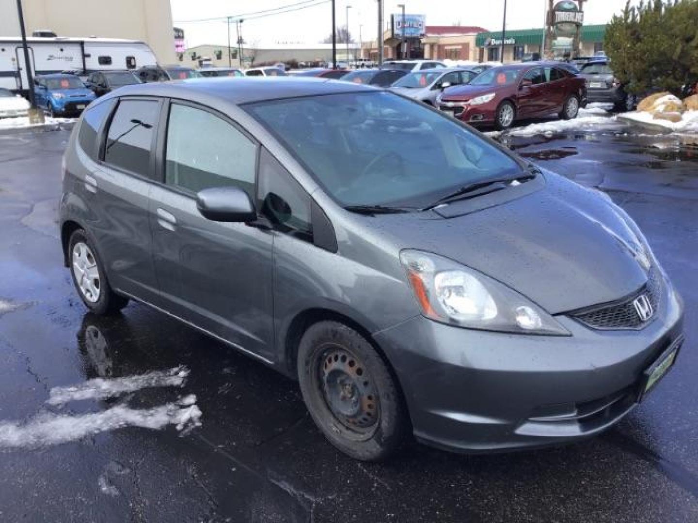 2013 GRAY /Gray Cloth Interior Honda Fit 5-Speed AT (JHMGE8H34DC) with an 1.5L L4 SOHC 16V engine, 5-Speed Automatic transmission, located at 1235 N Woodruff Ave., Idaho Falls, 83401, (208) 523-1053, 43.507172, -112.000488 - This 2013 Honda Fit, has 210,000 miles. It comes with cloth interior, cruise control, power windows, and locks. At Timberline Auto it is always easy to find a great deal on your next vehicle! Our experienced sales staff can help find the right vehicle will fit your needs. Our knowledgeable finance d - Photo#6