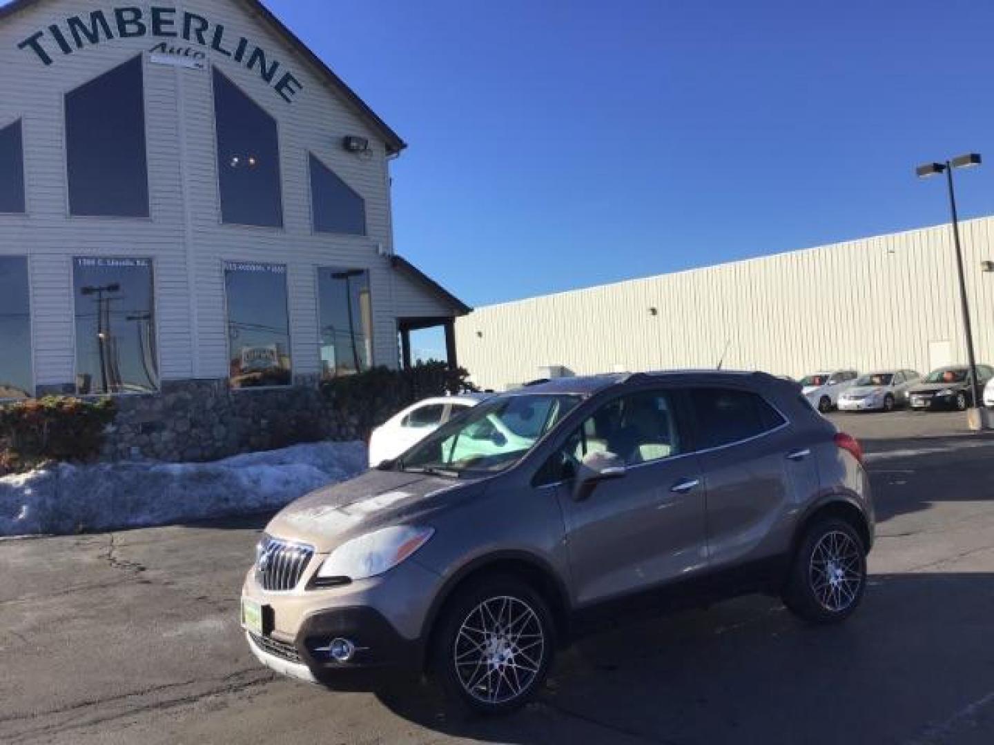 2014 Stain Steel Gray Metallic Buick Encore Premium AWD (KL4CJHSB6EB) with an 1.4L L4 DOHC 16V TURBO engine, 6-Speed Automatic transmission, located at 1235 N Woodruff Ave., Idaho Falls, 83401, (208) 523-1053, 43.507172, -112.000488 - This 2014 Buick Encore Premium AWD, has 100,000 miles. Comes with leather interior, heated seats, back up camera, power seats, power locks and doors. At Timberline Auto it is always easy to find a great deal on your next vehicle! Our experienced sales staff can help find the right vehicle will fit y - Photo#0