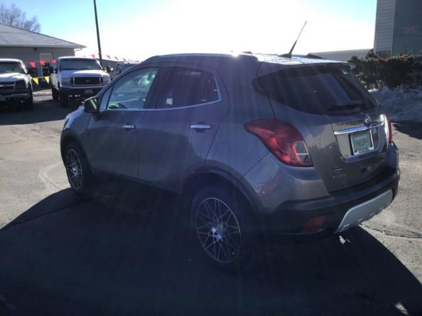 2014 Stain Steel Gray Metallic Buick Encore Premium AWD (KL4CJHSB6EB) with an 1.4L L4 DOHC 16V TURBO engine, 6-Speed Automatic transmission, located at 1235 N Woodruff Ave., Idaho Falls, 83401, (208) 523-1053, 43.507172, -112.000488 - This 2014 Buick Encore Premium AWD, has 100,000 miles. Comes with leather interior, heated seats, back up camera, power seats, power locks and doors. At Timberline Auto it is always easy to find a great deal on your next vehicle! Our experienced sales staff can help find the right vehicle will fit y - Photo#2