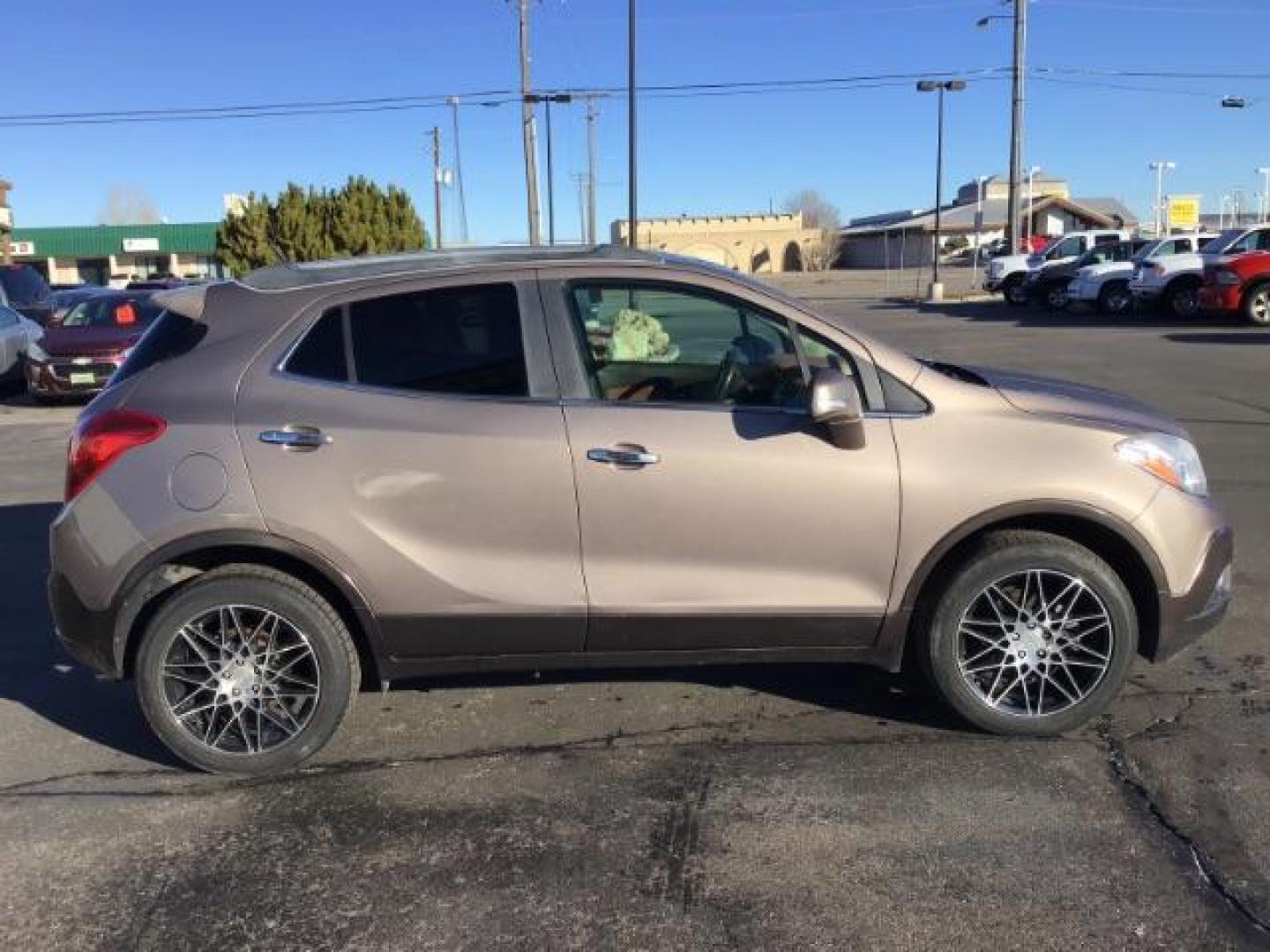 2014 Stain Steel Gray Metallic Buick Encore Premium AWD (KL4CJHSB6EB) with an 1.4L L4 DOHC 16V TURBO engine, 6-Speed Automatic transmission, located at 1235 N Woodruff Ave., Idaho Falls, 83401, (208) 523-1053, 43.507172, -112.000488 - This 2014 Buick Encore Premium AWD, has 100,000 miles. Comes with leather interior, heated seats, back up camera, power seats, power locks and doors. At Timberline Auto it is always easy to find a great deal on your next vehicle! Our experienced sales staff can help find the right vehicle will fit y - Photo#5