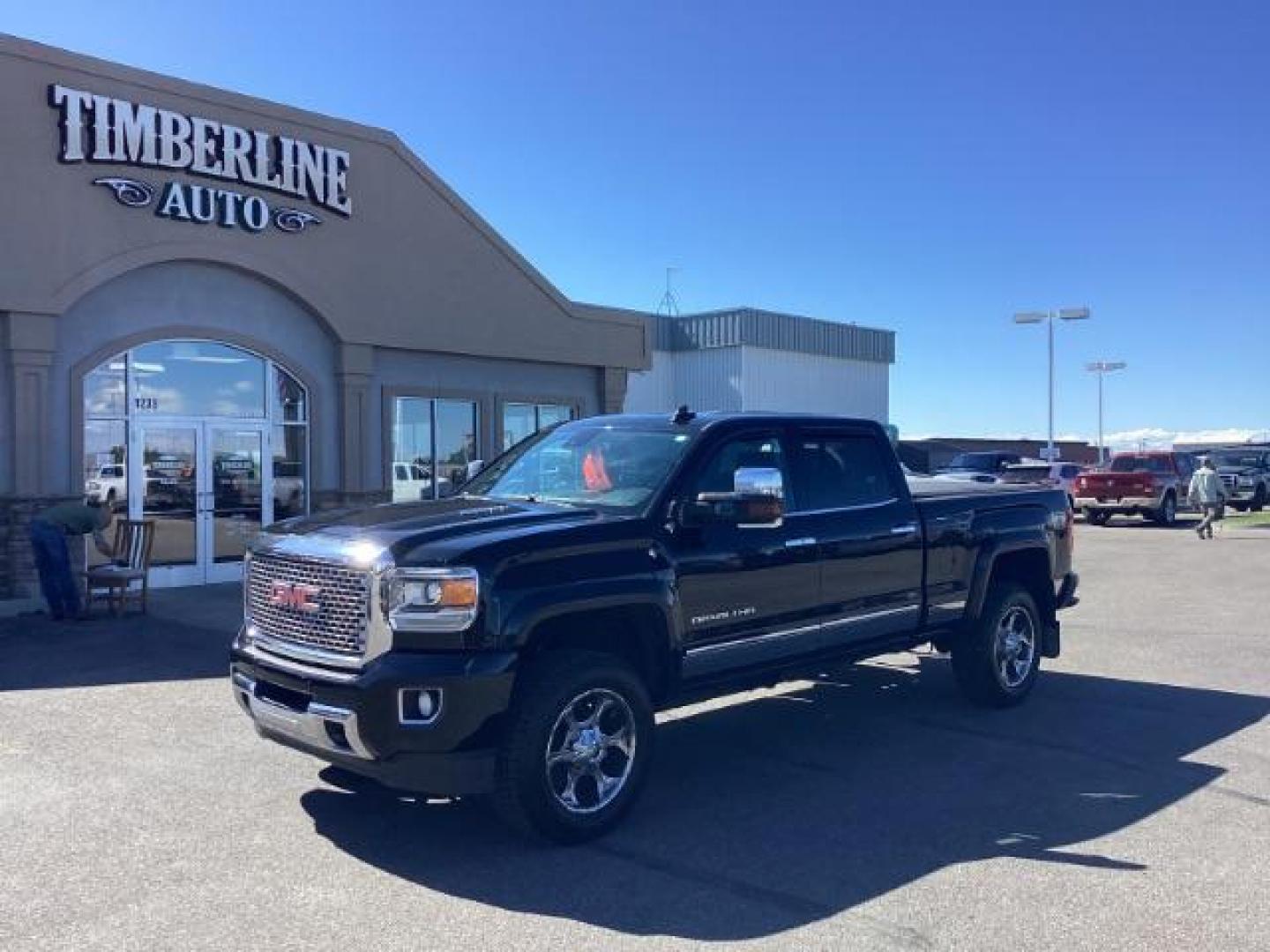 2015 Onyx Black /Jet Black GMC Sierra 3500HD Denali Crew Cab 4WD (1GT424E85FF) with an 6.6L V8 OHV 16 DIESEL engine, 6-Speed Automatic transmission, located at 1235 N Woodruff Ave., Idaho Falls, 83401, (208) 523-1053, 43.507172, -112.000488 - Photo#0