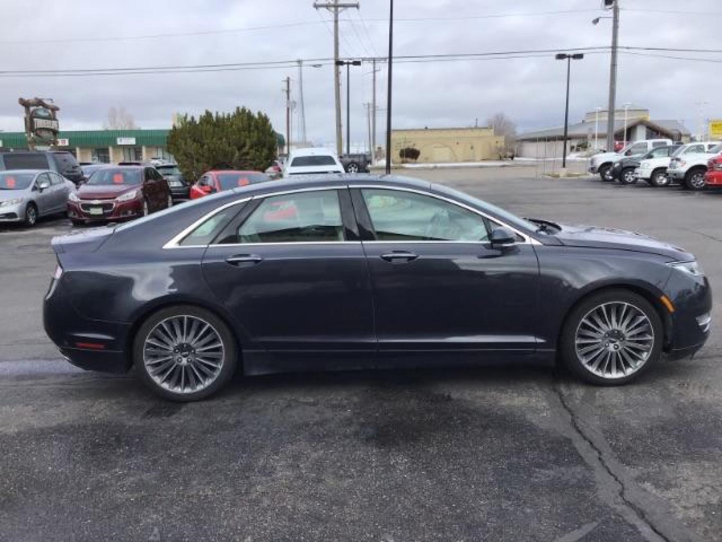 2013 BLUE /Light Dune Lincoln MKZ Hybrid Sedan (3LN6L2LU1DR) with an 2.5L L4 DOHC 16V HYBRID engine, Continuously Variable Transmission transmission, located at 1235 N Woodruff Ave., Idaho Falls, 83401, (208) 523-1053, 43.507172, -112.000488 - This 2013 Lincoln MKZ Hybrid, has 108,000 miles. Comes with leather interior, power seats, power windows, touch screen stereo, heated seats, and sunroof. At Timberline Auto it is always easy to find a great deal on your next vehicle! Our experienced sales staff can help find the right vehicle will f - Photo#5