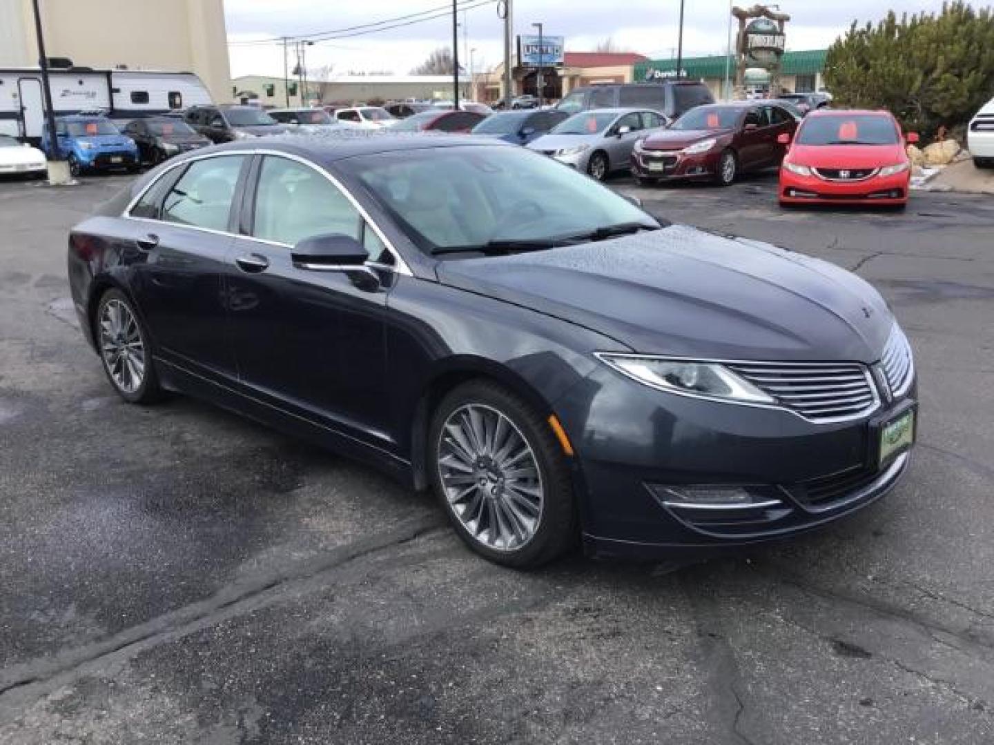 2013 BLUE /Light Dune Lincoln MKZ Hybrid Sedan (3LN6L2LU1DR) with an 2.5L L4 DOHC 16V HYBRID engine, Continuously Variable Transmission transmission, located at 1235 N Woodruff Ave., Idaho Falls, 83401, (208) 523-1053, 43.507172, -112.000488 - This 2013 Lincoln MKZ Hybrid, has 108,000 miles. Comes with leather interior, power seats, power windows, touch screen stereo, heated seats, and sunroof. At Timberline Auto it is always easy to find a great deal on your next vehicle! Our experienced sales staff can help find the right vehicle will f - Photo#6