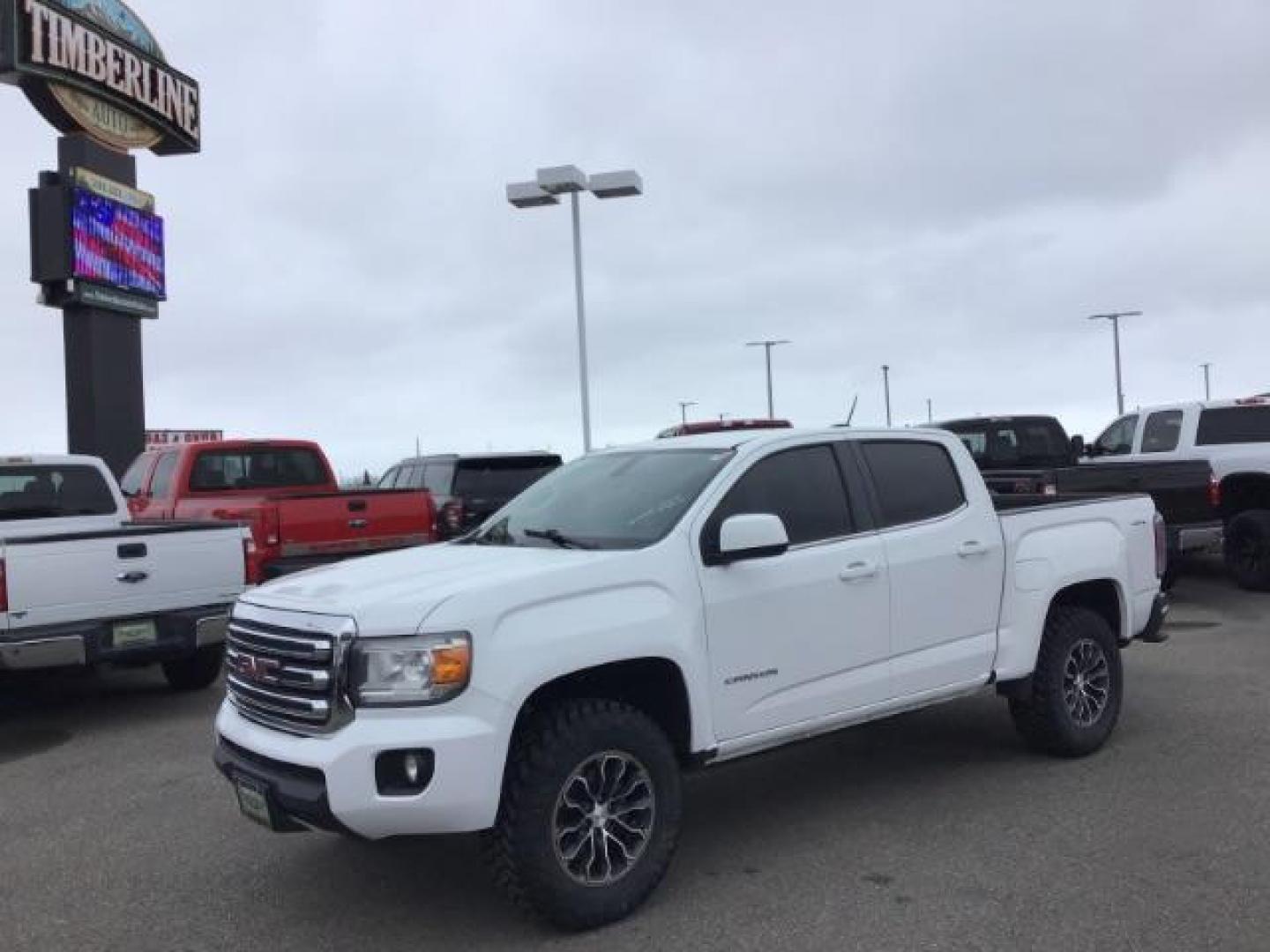 2015 Summit White /Jet Black GMC Canyon SLE Crew Cab 4WD Short Box (1GTG6BE38F1) with an 3.6L V6 DOHC 24V engine, 6-Speed Automatic transmission, located at 1235 N Woodruff Ave., Idaho Falls, 83401, (208) 523-1053, 43.507172, -112.000488 - This 2015 GMC Canyon SLE 4x4, has the 3.6L motor. It has 130,000 miles. Comes with cloth interior, blue tooth audio, back up camera, cruise control, power windows and locks. At Timberline Auto it is always easy to find a great deal on your next vehicle! Our experienced sales staff can help find the - Photo#0