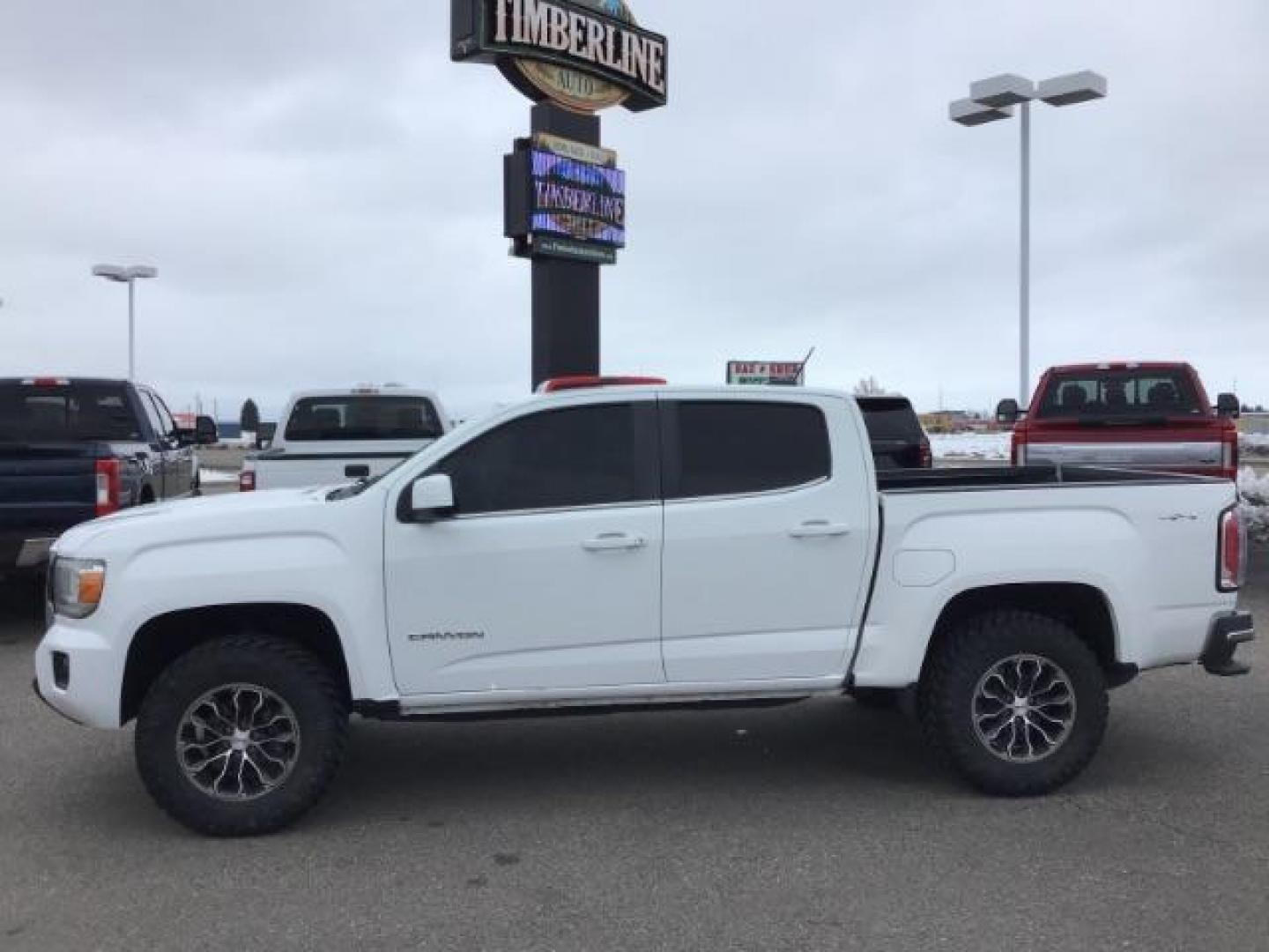 2015 Summit White /Jet Black GMC Canyon SLE Crew Cab 4WD Short Box (1GTG6BE38F1) with an 3.6L V6 DOHC 24V engine, 6-Speed Automatic transmission, located at 1235 N Woodruff Ave., Idaho Falls, 83401, (208) 523-1053, 43.507172, -112.000488 - This 2015 GMC Canyon SLE 4x4, has the 3.6L motor. It has 130,000 miles. Comes with cloth interior, blue tooth audio, back up camera, cruise control, power windows and locks. At Timberline Auto it is always easy to find a great deal on your next vehicle! Our experienced sales staff can help find the - Photo#1