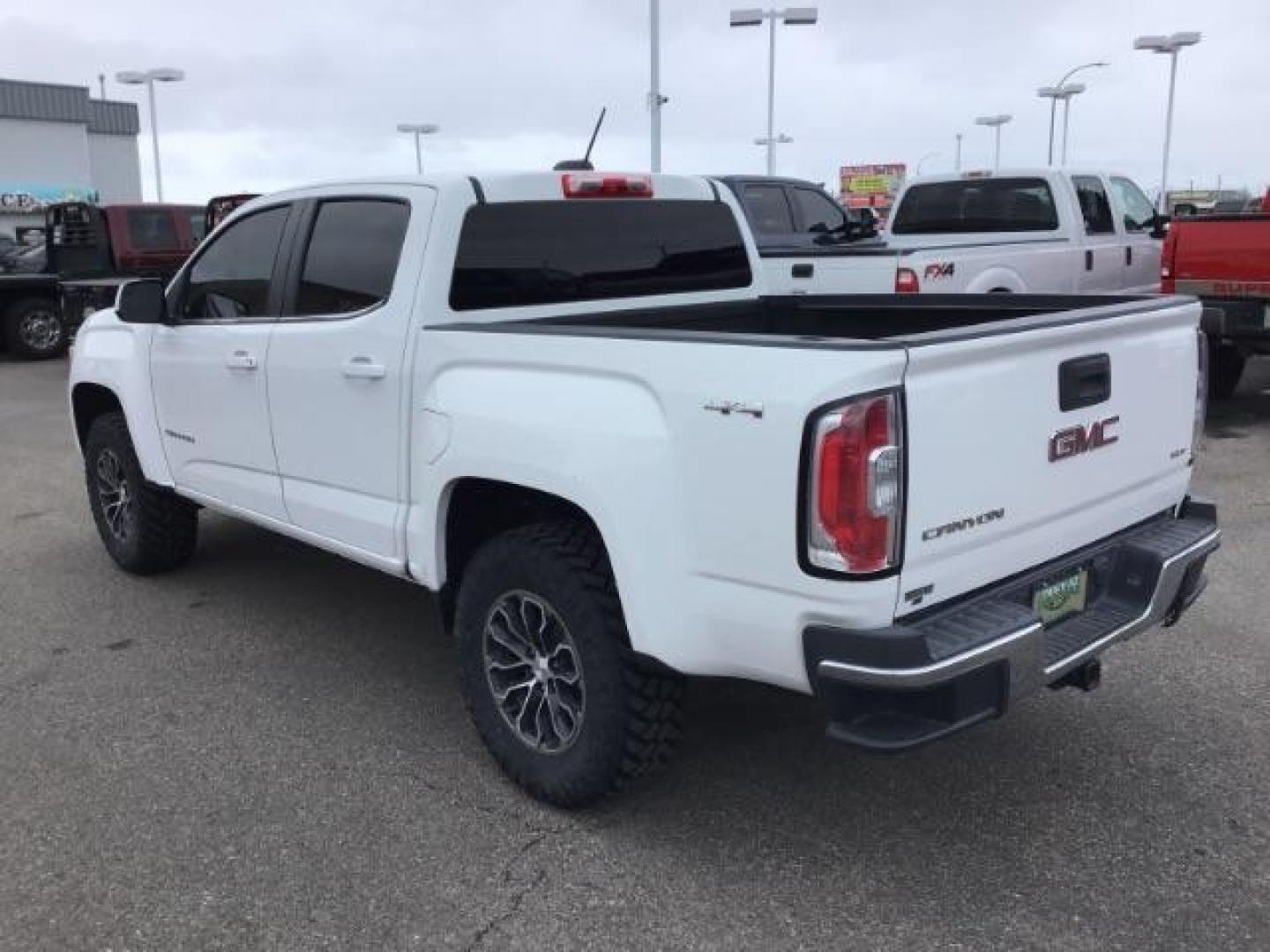 2015 Summit White /Jet Black GMC Canyon SLE Crew Cab 4WD Short Box (1GTG6BE38F1) with an 3.6L V6 DOHC 24V engine, 6-Speed Automatic transmission, located at 1235 N Woodruff Ave., Idaho Falls, 83401, (208) 523-1053, 43.507172, -112.000488 - This 2015 GMC Canyon SLE 4x4, has the 3.6L motor. It has 130,000 miles. Comes with cloth interior, blue tooth audio, back up camera, cruise control, power windows and locks. At Timberline Auto it is always easy to find a great deal on your next vehicle! Our experienced sales staff can help find the - Photo#2