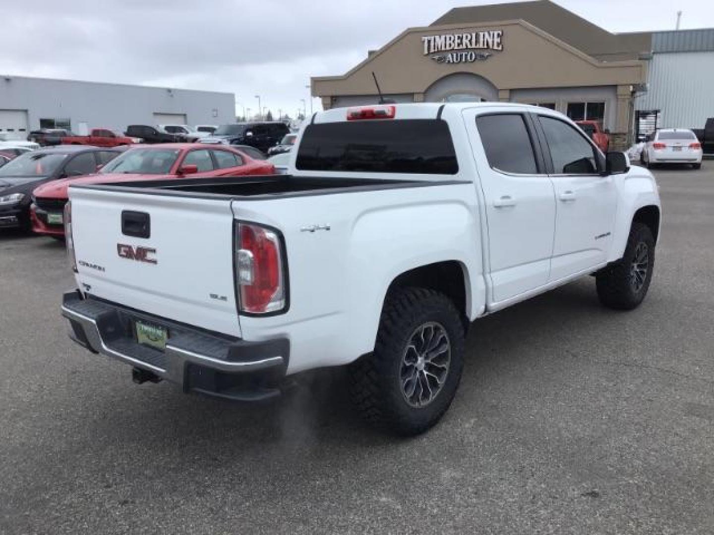 2015 Summit White /Jet Black GMC Canyon SLE Crew Cab 4WD Short Box (1GTG6BE38F1) with an 3.6L V6 DOHC 24V engine, 6-Speed Automatic transmission, located at 1235 N Woodruff Ave., Idaho Falls, 83401, (208) 523-1053, 43.507172, -112.000488 - This 2015 GMC Canyon SLE 4x4, has the 3.6L motor. It has 130,000 miles. Comes with cloth interior, blue tooth audio, back up camera, cruise control, power windows and locks. At Timberline Auto it is always easy to find a great deal on your next vehicle! Our experienced sales staff can help find the - Photo#4