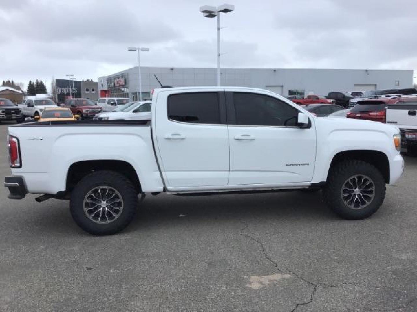 2015 Summit White /Jet Black GMC Canyon SLE Crew Cab 4WD Short Box (1GTG6BE38F1) with an 3.6L V6 DOHC 24V engine, 6-Speed Automatic transmission, located at 1235 N Woodruff Ave., Idaho Falls, 83401, (208) 523-1053, 43.507172, -112.000488 - This 2015 GMC Canyon SLE 4x4, has the 3.6L motor. It has 130,000 miles. Comes with cloth interior, blue tooth audio, back up camera, cruise control, power windows and locks. At Timberline Auto it is always easy to find a great deal on your next vehicle! Our experienced sales staff can help find the - Photo#5