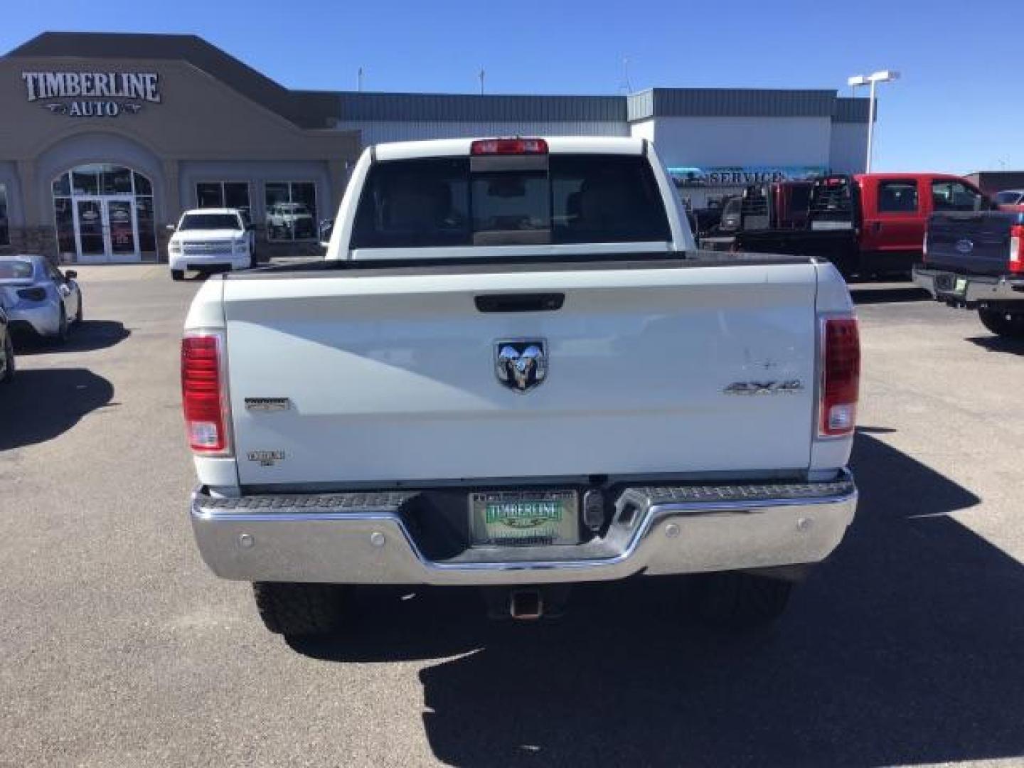 2017 WHITE /Black, leather RAM 3500 Laramie Crew Cab SWB 4WD (3C63R3EL0HG) with an 6.7L L6 OHV 24V TURBO DIESEL engine, 6-Speed Automatic transmission, located at 1235 N Woodruff Ave., Idaho Falls, 83401, (208) 523-1053, 43.507172, -112.000488 - This 2017 Ram 3500 Laramie 4x4, has the 6.7L cummins motor. It has 116,000 miles. Comes with leather interior, heated and cooled seats, dual power seats, navigation, back up camera, spray in bedliner, and blue tooth audio. At Timberline Auto it is always easy to find a great deal on your next vehicl - Photo#3