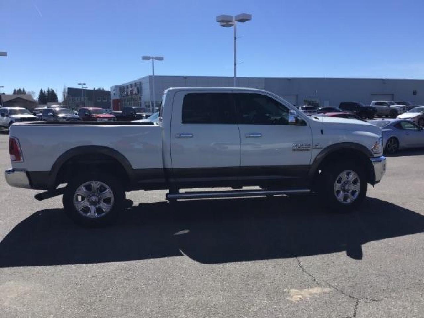 2017 WHITE /Black, leather RAM 3500 Laramie Crew Cab SWB 4WD (3C63R3EL0HG) with an 6.7L L6 OHV 24V TURBO DIESEL engine, 6-Speed Automatic transmission, located at 1235 N Woodruff Ave., Idaho Falls, 83401, (208) 523-1053, 43.507172, -112.000488 - This 2017 Ram 3500 Laramie 4x4, has the 6.7L cummins motor. It has 116,000 miles. Comes with leather interior, heated and cooled seats, dual power seats, navigation, back up camera, spray in bedliner, and blue tooth audio. At Timberline Auto it is always easy to find a great deal on your next vehicl - Photo#5