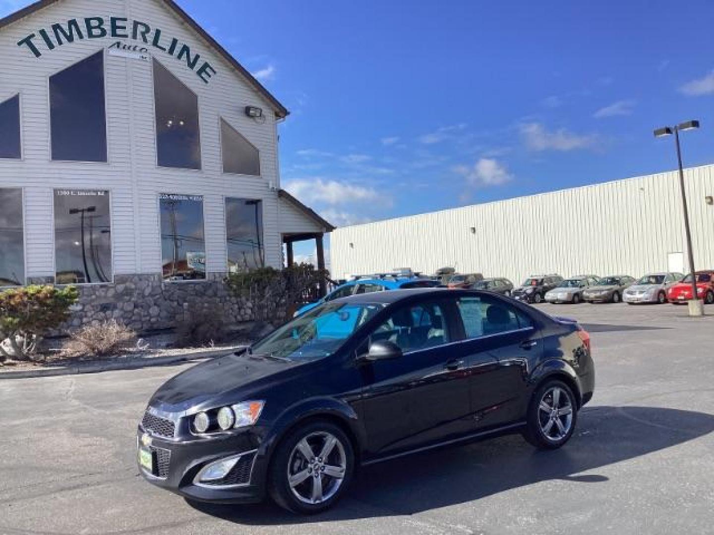 2015 Black Granite Metallic /Jet Black Chevrolet Sonic RS Auto Sedan (1G1JG5SBXF4) with an 1.4L L4 DOHC 24V TURBO engine, 6-Speed Automatic transmission, located at 1235 N Woodruff Ave., Idaho Falls, 83401, (208) 523-1053, 43.507172, -112.000488 - The 2015 Chevrolet Sonic RS is a sporty version of the Chevrolet Sonic, a subcompact car. Here are some of the features you might find on the 2015 Chevrolet Sonic RS: Turbocharged Engine: The Sonic RS is typically equipped with a turbocharged 1.4-liter inline-four engine, which delivers more power - Photo#0