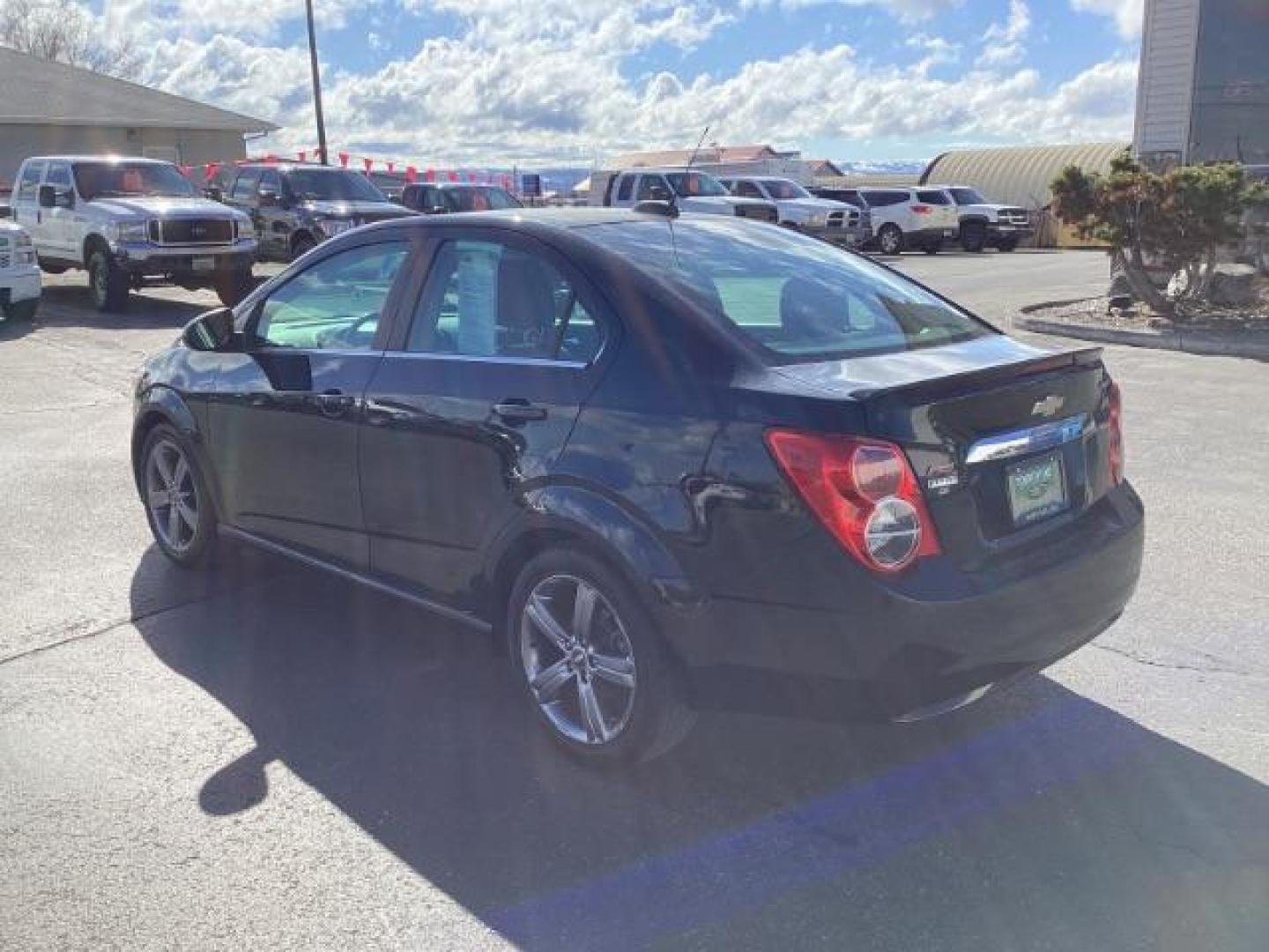 2015 Black Granite Metallic /Jet Black Chevrolet Sonic RS Auto Sedan (1G1JG5SBXF4) with an 1.4L L4 DOHC 24V TURBO engine, 6-Speed Automatic transmission, located at 1235 N Woodruff Ave., Idaho Falls, 83401, (208) 523-1053, 43.507172, -112.000488 - The 2015 Chevrolet Sonic RS is a sporty version of the Chevrolet Sonic, a subcompact car. Here are some of the features you might find on the 2015 Chevrolet Sonic RS: Turbocharged Engine: The Sonic RS is typically equipped with a turbocharged 1.4-liter inline-four engine, which delivers more power - Photo#2