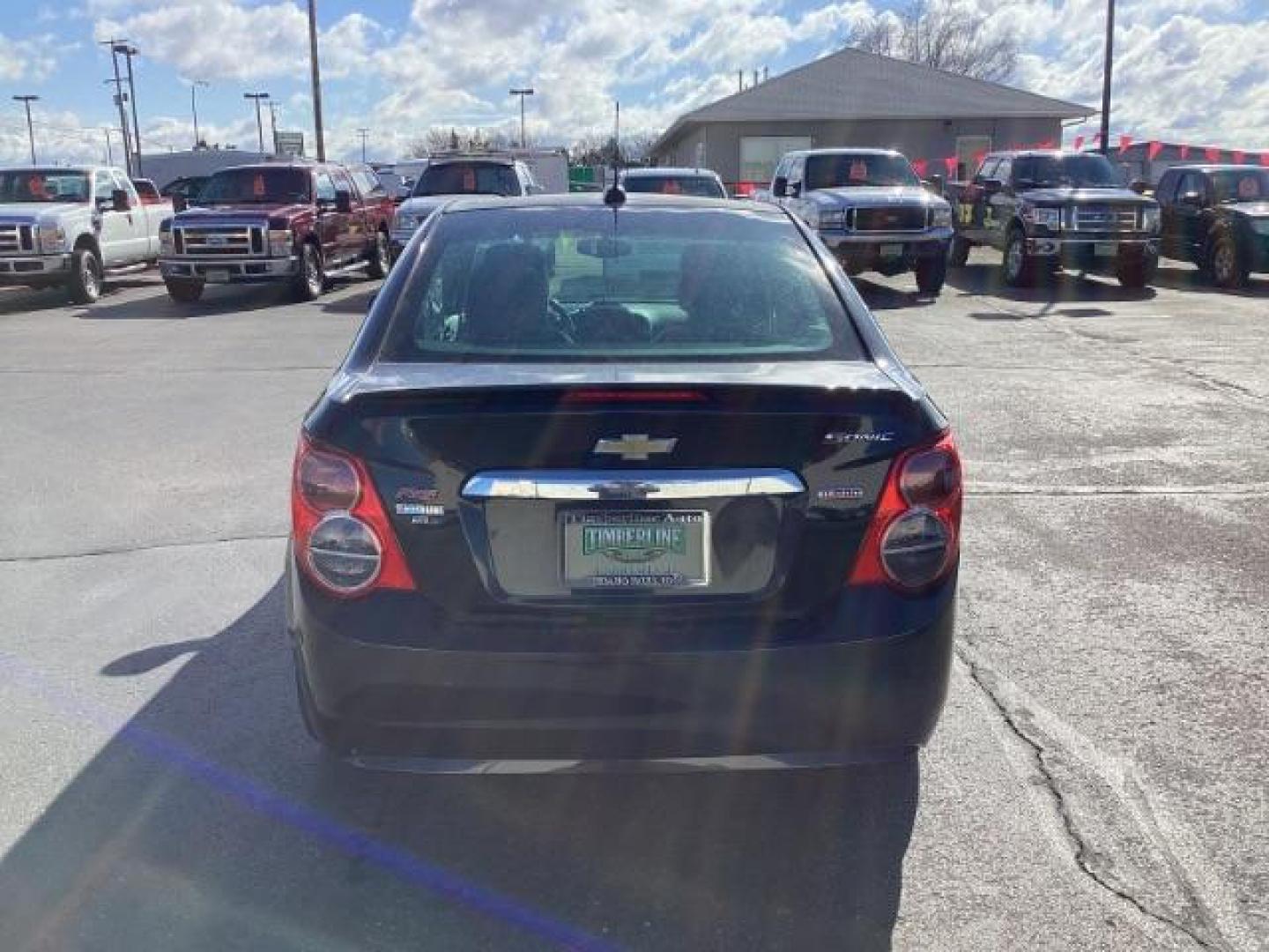 2015 Black Granite Metallic /Jet Black Chevrolet Sonic RS Auto Sedan (1G1JG5SBXF4) with an 1.4L L4 DOHC 24V TURBO engine, 6-Speed Automatic transmission, located at 1235 N Woodruff Ave., Idaho Falls, 83401, (208) 523-1053, 43.507172, -112.000488 - The 2015 Chevrolet Sonic RS is a sporty version of the Chevrolet Sonic, a subcompact car. Here are some of the features you might find on the 2015 Chevrolet Sonic RS: Turbocharged Engine: The Sonic RS is typically equipped with a turbocharged 1.4-liter inline-four engine, which delivers more power - Photo#3