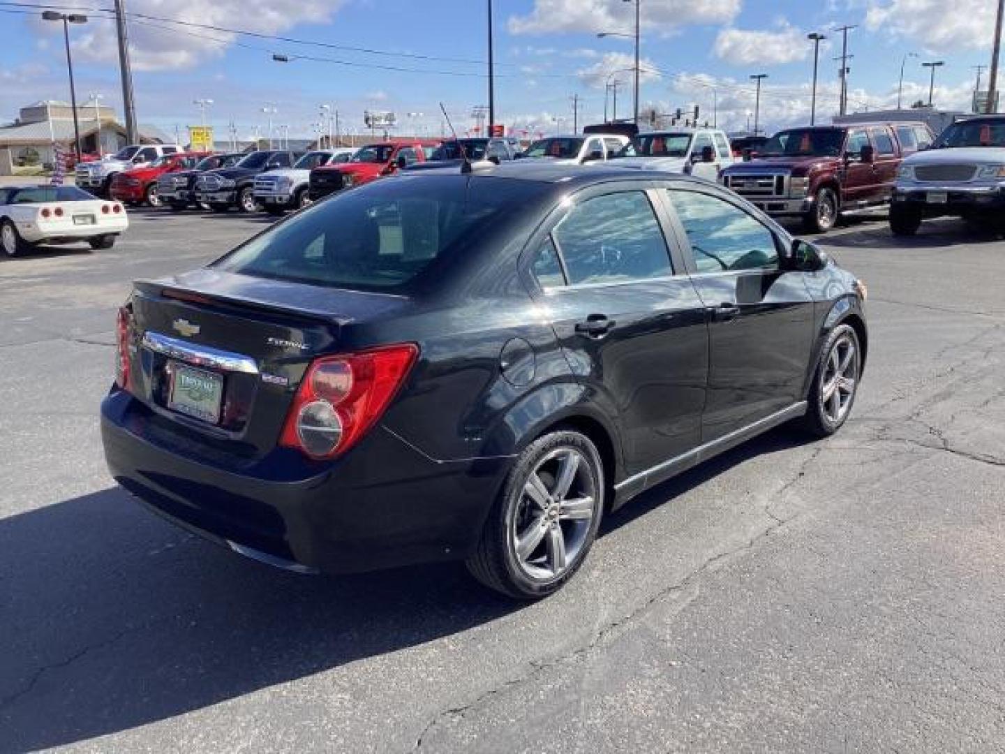 2015 Black Granite Metallic /Jet Black Chevrolet Sonic RS Auto Sedan (1G1JG5SBXF4) with an 1.4L L4 DOHC 24V TURBO engine, 6-Speed Automatic transmission, located at 1235 N Woodruff Ave., Idaho Falls, 83401, (208) 523-1053, 43.507172, -112.000488 - The 2015 Chevrolet Sonic RS is a sporty version of the Chevrolet Sonic, a subcompact car. Here are some of the features you might find on the 2015 Chevrolet Sonic RS: Turbocharged Engine: The Sonic RS is typically equipped with a turbocharged 1.4-liter inline-four engine, which delivers more power - Photo#4