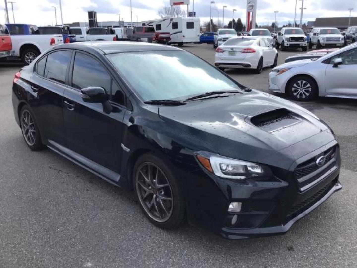 2016 BLACK /Carbon Black, leather Subaru WRX STI Limited (JF1VA2Z60G9) with an 2.5L H4 DOHC 16V engine, 6-Speed Manual transmission, located at 1235 N Woodruff Ave., Idaho Falls, 83401, (208) 523-1053, 43.507172, -112.000488 - This 2016 Subaru WRX STI, only has 71,945 miles. It has a manual transmission. Comes with cloth seats, heated seats, driver power seat, steering wheel controls, back up camera, blue tooth audio, keyless remote, and power windows and locks. At Timberline Auto it is always easy to find a great deal on - Photo#5