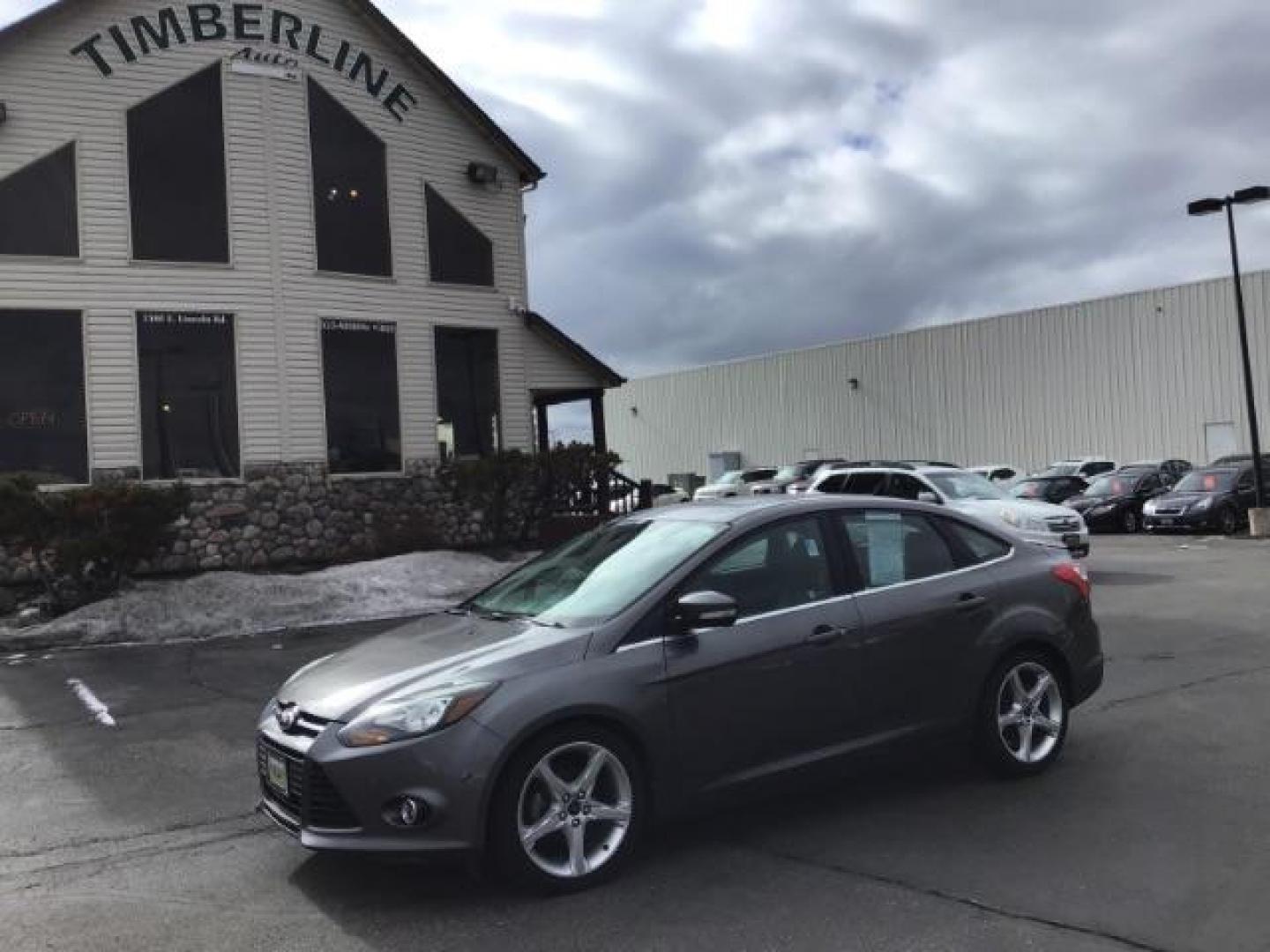 2013 Ford Focus Titanium Sedan (1FADP3J25DL) with an 2.0L L4 DOHC 16V engine, 6-Speed Automatic transmission, located at 1235 N Woodruff Ave., Idaho Falls, 83401, (208) 523-1053, 43.507172, -112.000488 - This 2013 Ford Focus Titanium , has 155,000 miles. It comes with leather interior, heated seats, push button start, back up camera, blue tooth audio, cruise control, and sunroof. At Timberline Auto it is always easy to find a great deal on your next vehicle! Our experienced sales staff can help find - Photo#0