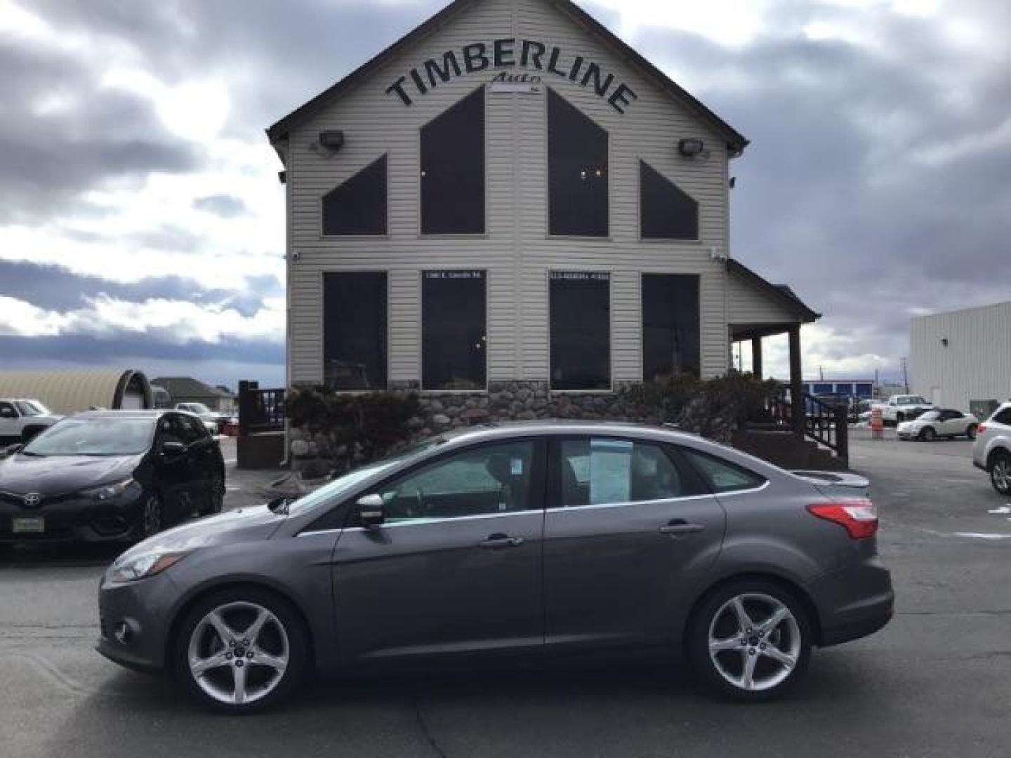 2013 Ford Focus Titanium Sedan (1FADP3J25DL) with an 2.0L L4 DOHC 16V engine, 6-Speed Automatic transmission, located at 1235 N Woodruff Ave., Idaho Falls, 83401, (208) 523-1053, 43.507172, -112.000488 - This 2013 Ford Focus Titanium , has 155,000 miles. It comes with leather interior, heated seats, push button start, back up camera, blue tooth audio, cruise control, and sunroof. At Timberline Auto it is always easy to find a great deal on your next vehicle! Our experienced sales staff can help find - Photo#1