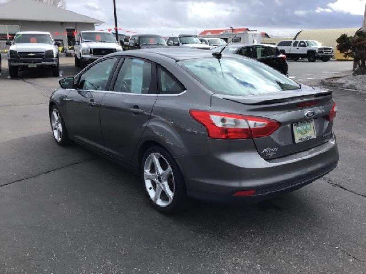 2013 Ford Focus Titanium Sedan (1FADP3J25DL) with an 2.0L L4 DOHC 16V engine, 6-Speed Automatic transmission, located at 1235 N Woodruff Ave., Idaho Falls, 83401, (208) 523-1053, 43.507172, -112.000488 - This 2013 Ford Focus Titanium , has 155,000 miles. It comes with leather interior, heated seats, push button start, back up camera, blue tooth audio, cruise control, and sunroof. At Timberline Auto it is always easy to find a great deal on your next vehicle! Our experienced sales staff can help find - Photo#2