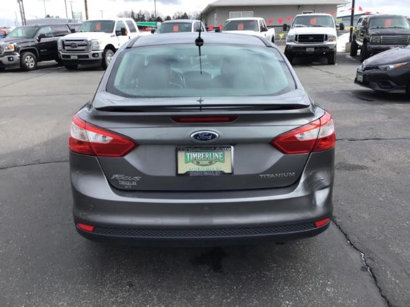 2013 Ford Focus Titanium Sedan (1FADP3J25DL) with an 2.0L L4 DOHC 16V engine, 6-Speed Automatic transmission, located at 1235 N Woodruff Ave., Idaho Falls, 83401, (208) 523-1053, 43.507172, -112.000488 - This 2013 Ford Focus Titanium , has 155,000 miles. It comes with leather interior, heated seats, push button start, back up camera, blue tooth audio, cruise control, and sunroof. At Timberline Auto it is always easy to find a great deal on your next vehicle! Our experienced sales staff can help find - Photo#3