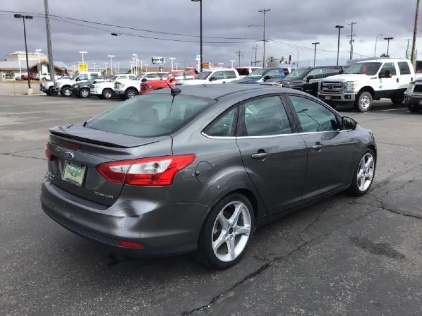 2013 Ford Focus Titanium Sedan (1FADP3J25DL) with an 2.0L L4 DOHC 16V engine, 6-Speed Automatic transmission, located at 1235 N Woodruff Ave., Idaho Falls, 83401, (208) 523-1053, 43.507172, -112.000488 - This 2013 Ford Focus Titanium , has 155,000 miles. It comes with leather interior, heated seats, push button start, back up camera, blue tooth audio, cruise control, and sunroof. At Timberline Auto it is always easy to find a great deal on your next vehicle! Our experienced sales staff can help find - Photo#4