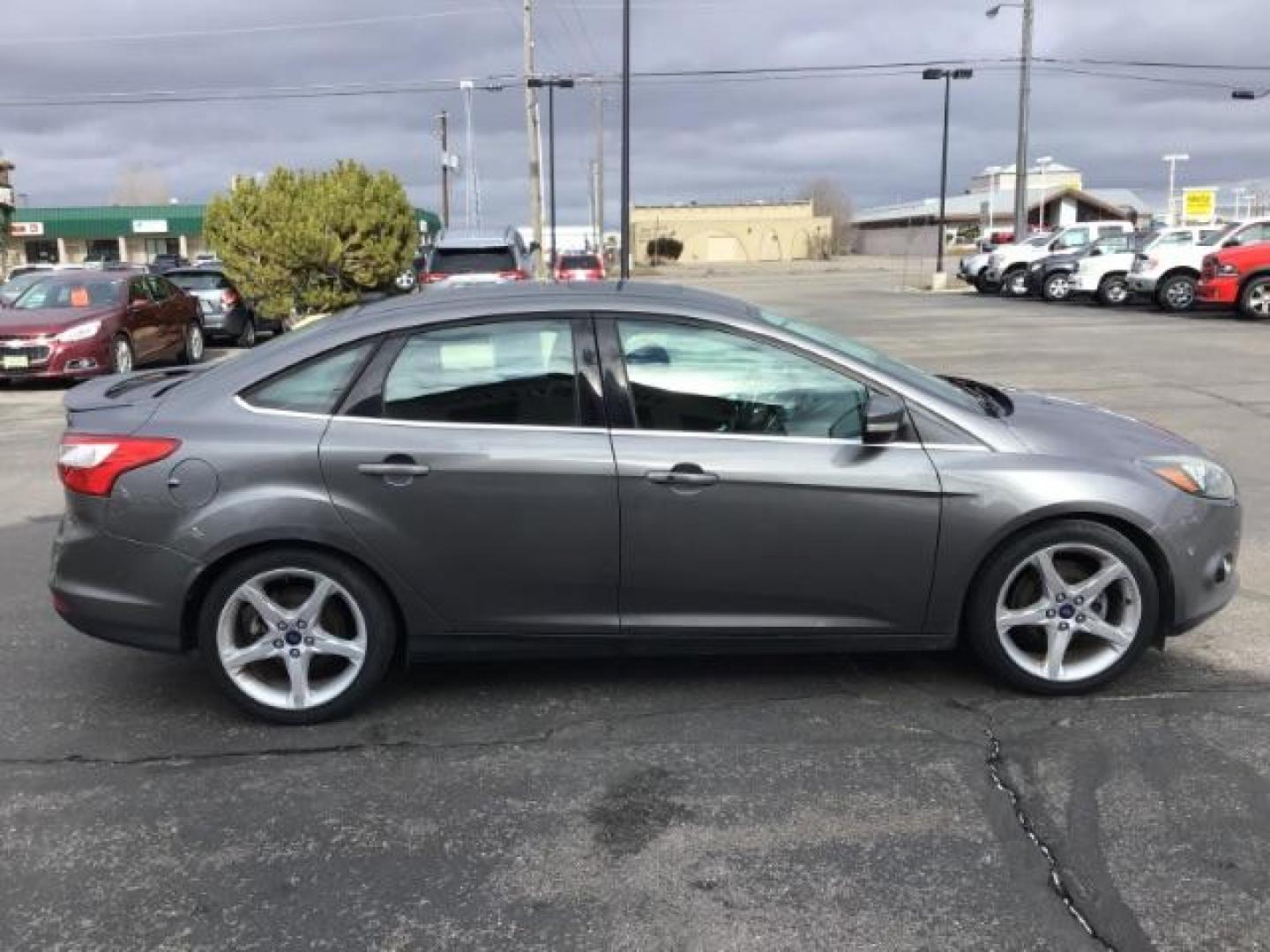 2013 Ford Focus Titanium Sedan (1FADP3J25DL) with an 2.0L L4 DOHC 16V engine, 6-Speed Automatic transmission, located at 1235 N Woodruff Ave., Idaho Falls, 83401, (208) 523-1053, 43.507172, -112.000488 - This 2013 Ford Focus Titanium , has 155,000 miles. It comes with leather interior, heated seats, push button start, back up camera, blue tooth audio, cruise control, and sunroof. At Timberline Auto it is always easy to find a great deal on your next vehicle! Our experienced sales staff can help find - Photo#5