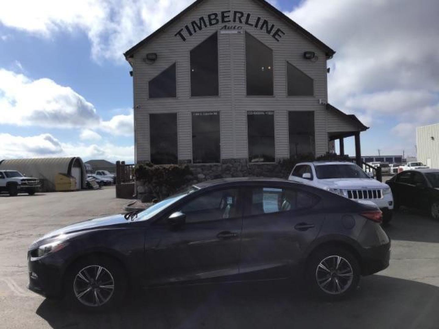 2015 Meteor Gray Mica /Black, cloth Mazda MAZDA3 i Sport AT 4-Door (3MZBM1U73FM) with an 2.0L L4 DOHC 16V engine, 6-Speed Automatic transmission, located at 1235 N Woodruff Ave., Idaho Falls, 83401, (208) 523-1053, 43.507172, -112.000488 - This 2015 Mazda 3, has 116,000 miles. It comes with cloth interior, cruise control, blue tooth audio, and power windows and locks. At Timberline Auto it is always easy to find a great deal on your next vehicle! Our experienced sales staff can help find the right vehicle will fit your needs. Our know - Photo#1