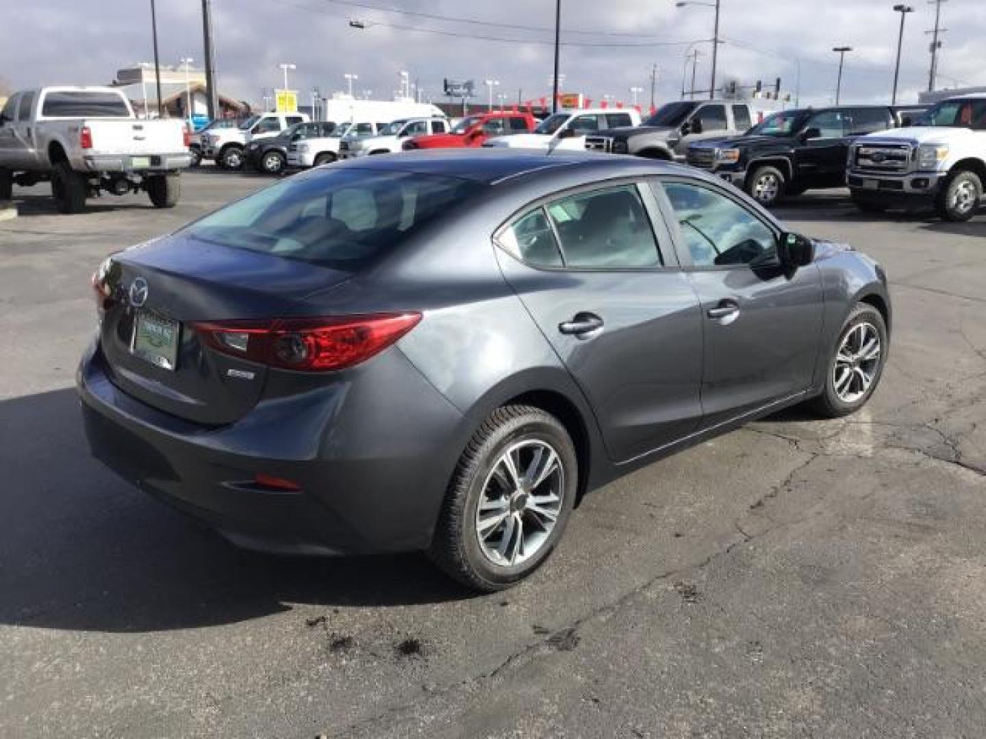 2015 Meteor Gray Mica /Black, cloth Mazda MAZDA3 i Sport AT 4-Door (3MZBM1U73FM) with an 2.0L L4 DOHC 16V engine, 6-Speed Automatic transmission, located at 1235 N Woodruff Ave., Idaho Falls, 83401, (208) 523-1053, 43.507172, -112.000488 - This 2015 Mazda 3, has 116,000 miles. It comes with cloth interior, cruise control, blue tooth audio, and power windows and locks. At Timberline Auto it is always easy to find a great deal on your next vehicle! Our experienced sales staff can help find the right vehicle will fit your needs. Our know - Photo#4