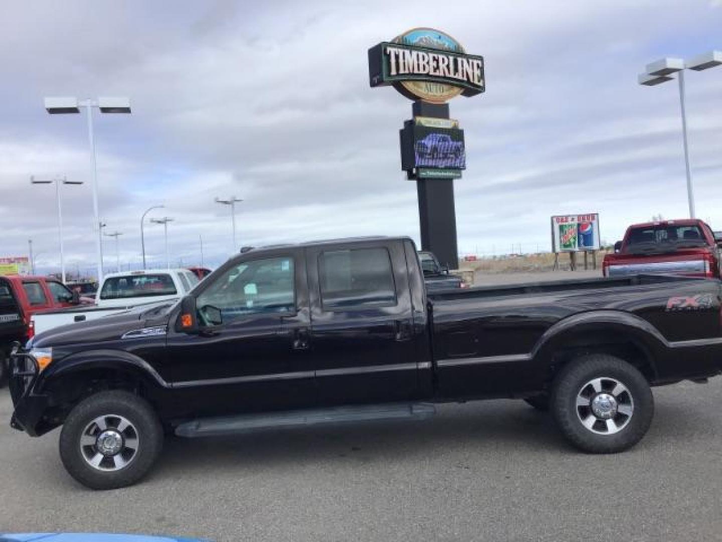 2014 BLACK /BLACK Ford F-250 SD Lariat Crew Cab Long Bed 4WD (1FT7W2BT5EE) with an 6.7L V8 OHV 16V DIESEL engine, 6-Speed Automatic transmission, located at 1235 N Woodruff Ave., Idaho Falls, 83401, (208) 523-1053, 43.507172, -112.000488 - This 2014 Ford F250 Lariat 4x4, has the 6.7 powerstroke motor. It has 98,000 miles. Comes with leather interior, heated and cooled seats, blue tooth audio, back up camera, cruise control, touch screen stereo, and turn over ball. At Timberline Auto it is always easy to find a great deal on your next - Photo#1