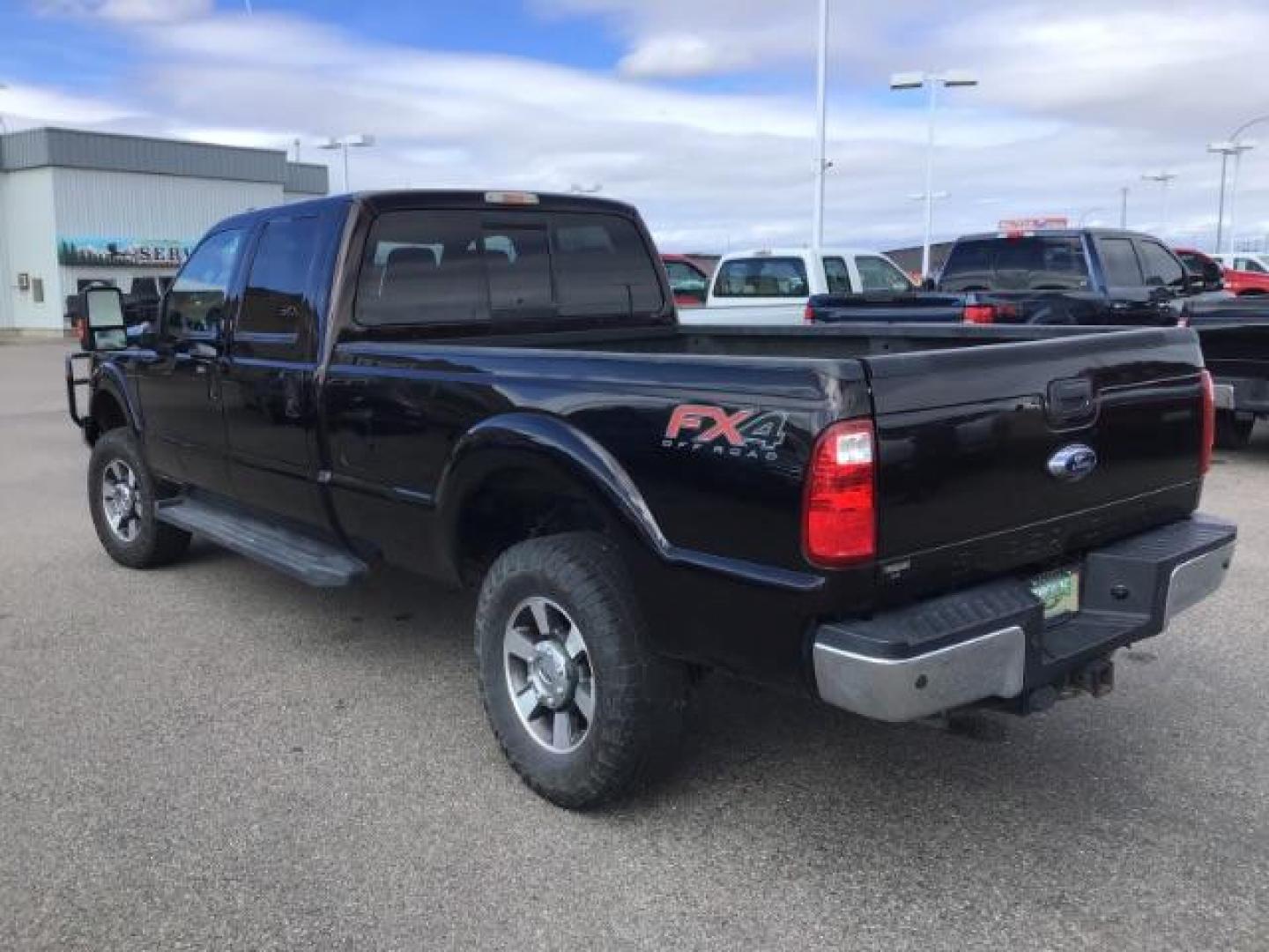 2014 BLACK /BLACK Ford F-250 SD Lariat Crew Cab Long Bed 4WD (1FT7W2BT5EE) with an 6.7L V8 OHV 16V DIESEL engine, 6-Speed Automatic transmission, located at 1235 N Woodruff Ave., Idaho Falls, 83401, (208) 523-1053, 43.507172, -112.000488 - This 2014 Ford F250 Lariat 4x4, has the 6.7 powerstroke motor. It has 98,000 miles. Comes with leather interior, heated and cooled seats, blue tooth audio, back up camera, cruise control, touch screen stereo, and turn over ball. At Timberline Auto it is always easy to find a great deal on your next - Photo#2