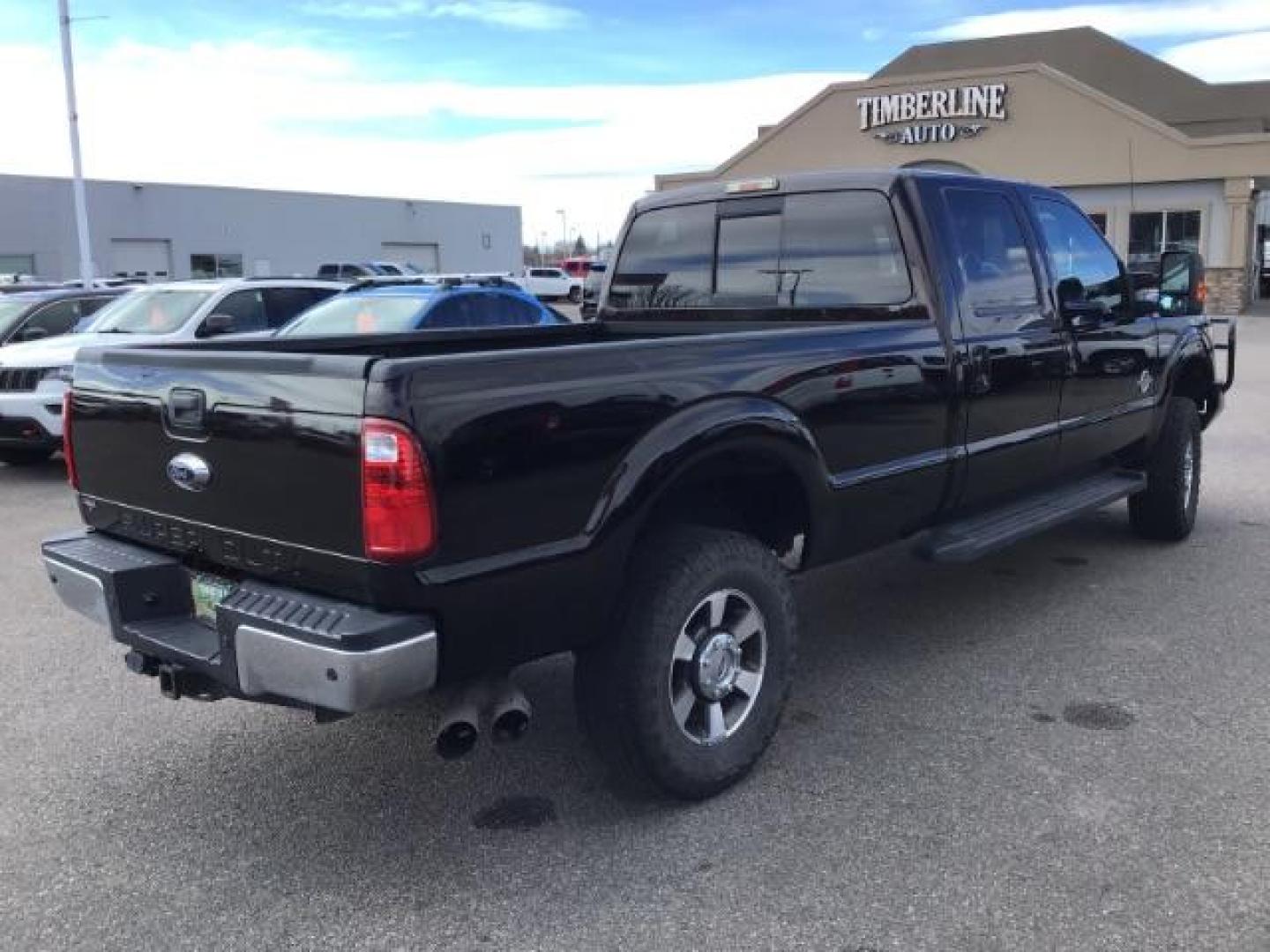 2014 BLACK /BLACK Ford F-250 SD Lariat Crew Cab Long Bed 4WD (1FT7W2BT5EE) with an 6.7L V8 OHV 16V DIESEL engine, 6-Speed Automatic transmission, located at 1235 N Woodruff Ave., Idaho Falls, 83401, (208) 523-1053, 43.507172, -112.000488 - This 2014 Ford F250 Lariat 4x4, has the 6.7 powerstroke motor. It has 98,000 miles. Comes with leather interior, heated and cooled seats, blue tooth audio, back up camera, cruise control, touch screen stereo, and turn over ball. At Timberline Auto it is always easy to find a great deal on your next - Photo#4