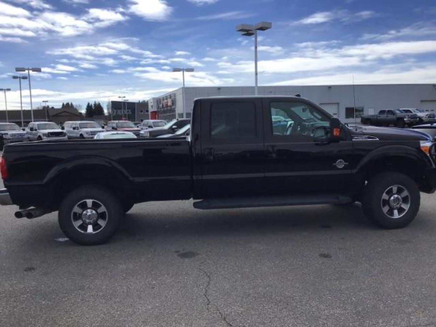 2014 BLACK /BLACK Ford F-250 SD Lariat Crew Cab Long Bed 4WD (1FT7W2BT5EE) with an 6.7L V8 OHV 16V DIESEL engine, 6-Speed Automatic transmission, located at 1235 N Woodruff Ave., Idaho Falls, 83401, (208) 523-1053, 43.507172, -112.000488 - This 2014 Ford F250 Lariat 4x4, has the 6.7 powerstroke motor. It has 98,000 miles. Comes with leather interior, heated and cooled seats, blue tooth audio, back up camera, cruise control, touch screen stereo, and turn over ball. At Timberline Auto it is always easy to find a great deal on your next - Photo#5