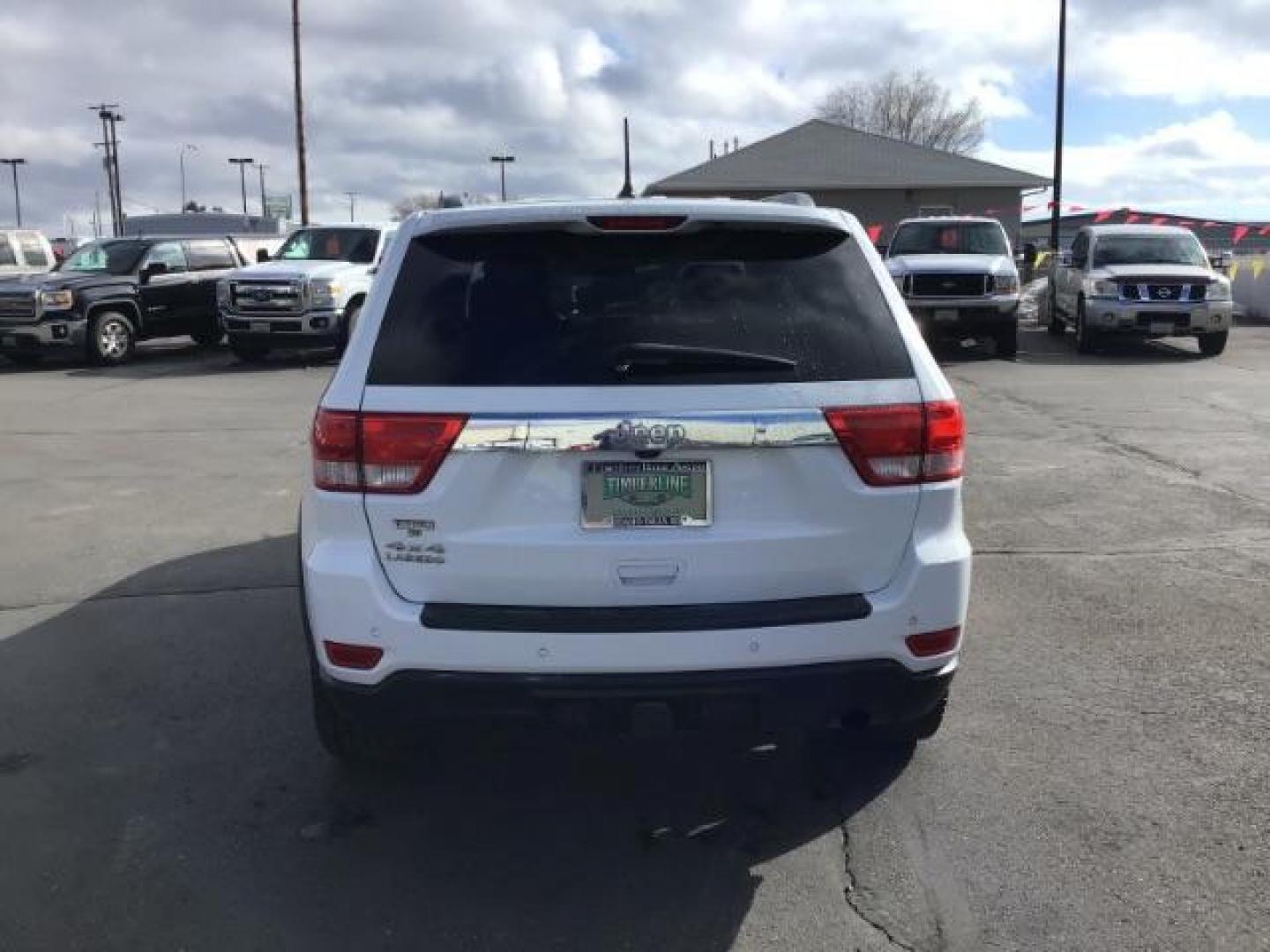 2013 Bright White /Dark Graystone/Medium Graystone Leather Interior Jeep Grand Cherokee Laredo 4WD (1C4RJFAG5DC) with an 3.6L V6 DOHC 24V engine, 5-Speed Automatic transmission, located at 1235 N Woodruff Ave., Idaho Falls, 83401, (208) 523-1053, 43.507172, -112.000488 - This 2013 Jeep Grand Cherokee Laredo 4x4, has 155,000 miles. It comes with leather seats, power seats, cruise control, touch screen stereo, sunroof, and power locks and windows. At Timberline Auto it is always easy to find a great deal on your next vehicle! Our experienced sales staff can help find - Photo#3