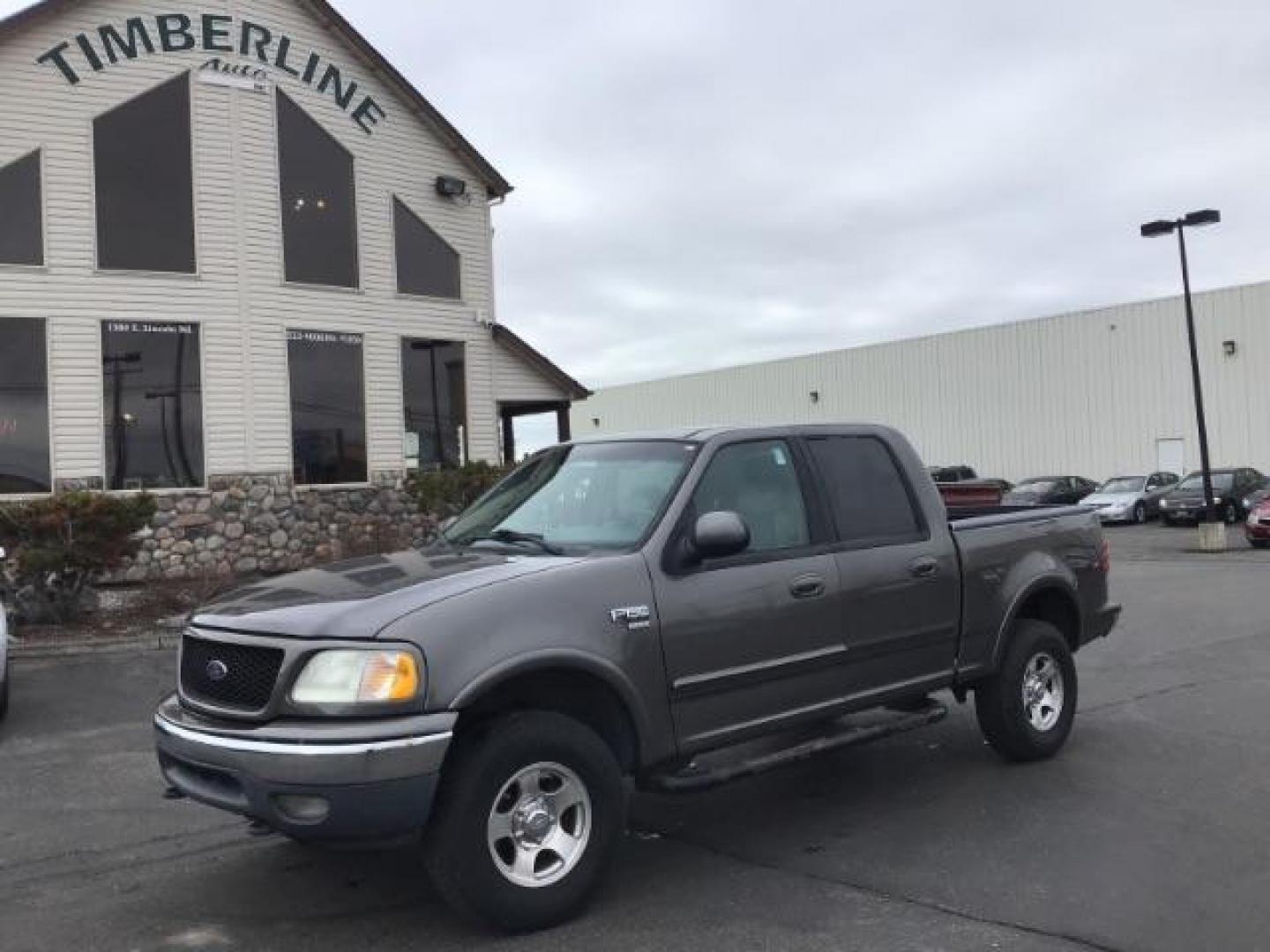 2002 Oxford White /Medium Graphite Cloth Interior Ford F-150 XLT SuperCrew Short Bed 4WD (1FTRW08L02K) with an 5.4L V8 SOHC 16V engine, 4-Speed Automatic transmission, located at 1235 N Woodruff Ave., Idaho Falls, 83401, (208) 523-1053, 43.507172, -112.000488 - This 2002 Ford F150 4x4 XLT, has 151,000 miles. Comes with cloth interior, cruise control, power drivers seat, AM/FM CD stereo, and power windows. At Timberline Auto it is always easy to find a great deal on your next vehicle! Our experienced sales staff can help find the right vehicle will fit your - Photo#0