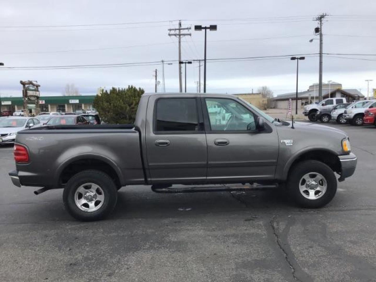 2002 Oxford White /Medium Graphite Cloth Interior Ford F-150 XLT SuperCrew Short Bed 4WD (1FTRW08L02K) with an 5.4L V8 SOHC 16V engine, 4-Speed Automatic transmission, located at 1235 N Woodruff Ave., Idaho Falls, 83401, (208) 523-1053, 43.507172, -112.000488 - This 2002 Ford F150 4x4 XLT, has 151,000 miles. Comes with cloth interior, cruise control, power drivers seat, AM/FM CD stereo, and power windows. At Timberline Auto it is always easy to find a great deal on your next vehicle! Our experienced sales staff can help find the right vehicle will fit your - Photo#5