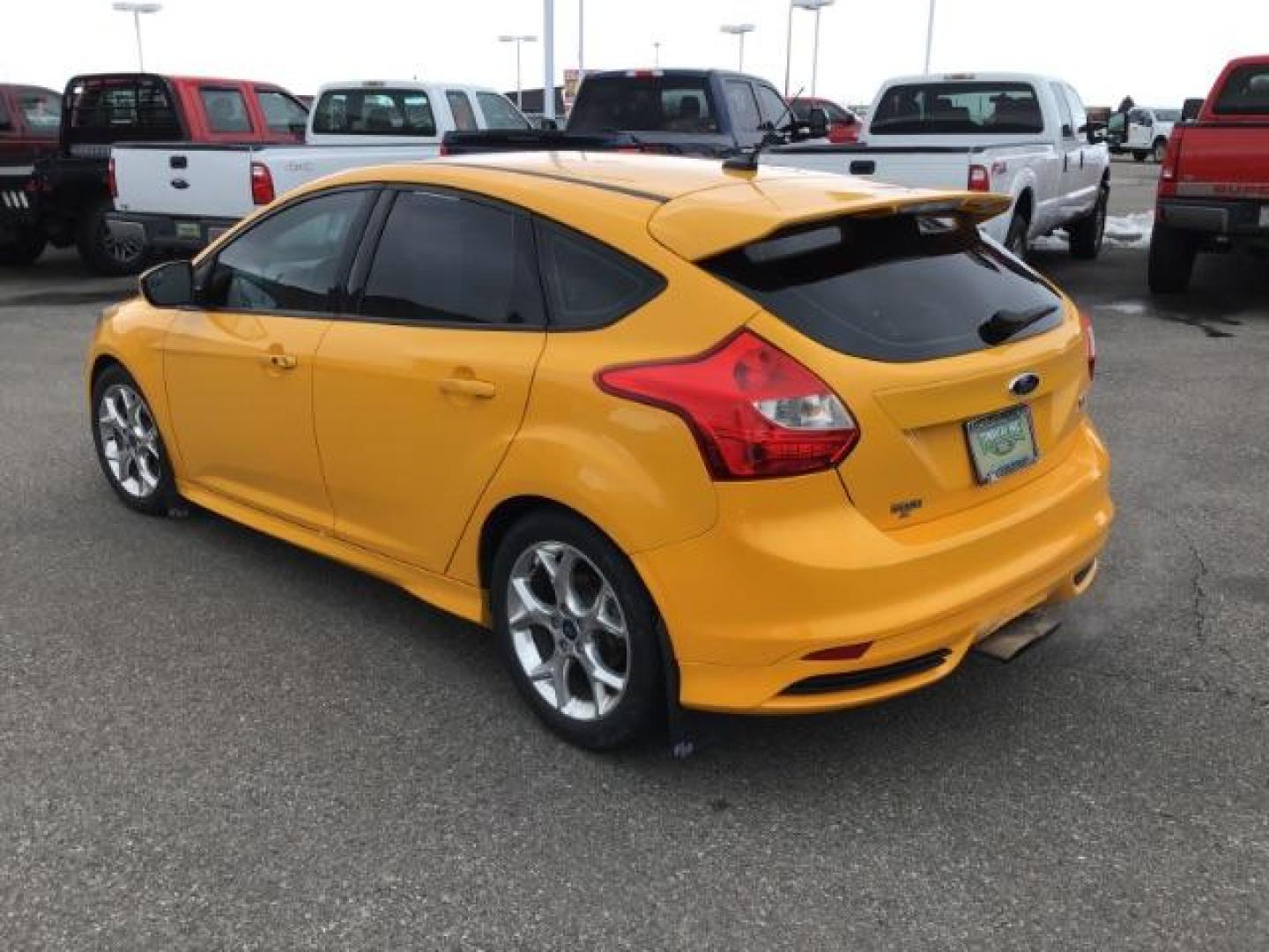 2014 YELLOW /Charcoal Black Ford Focus ST Hatch (1FADP3L96EL) with an 2.0L L4 DOHC 16V engine, 5-Speed Manual transmission, located at 1235 N Woodruff Ave., Idaho Falls, 83401, (208) 523-1053, 43.507172, -112.000488 - This 2014 Ford Focus ST, has 82,000 miles. It has a manual transmission. Comes with Leather interior, heated seats, sunroof, blue tooth audio, touch screen stereo, cruise control, power windows and locks. At Timberline Auto it is always easy to find a great deal on your next vehicle! Our experience - Photo#2