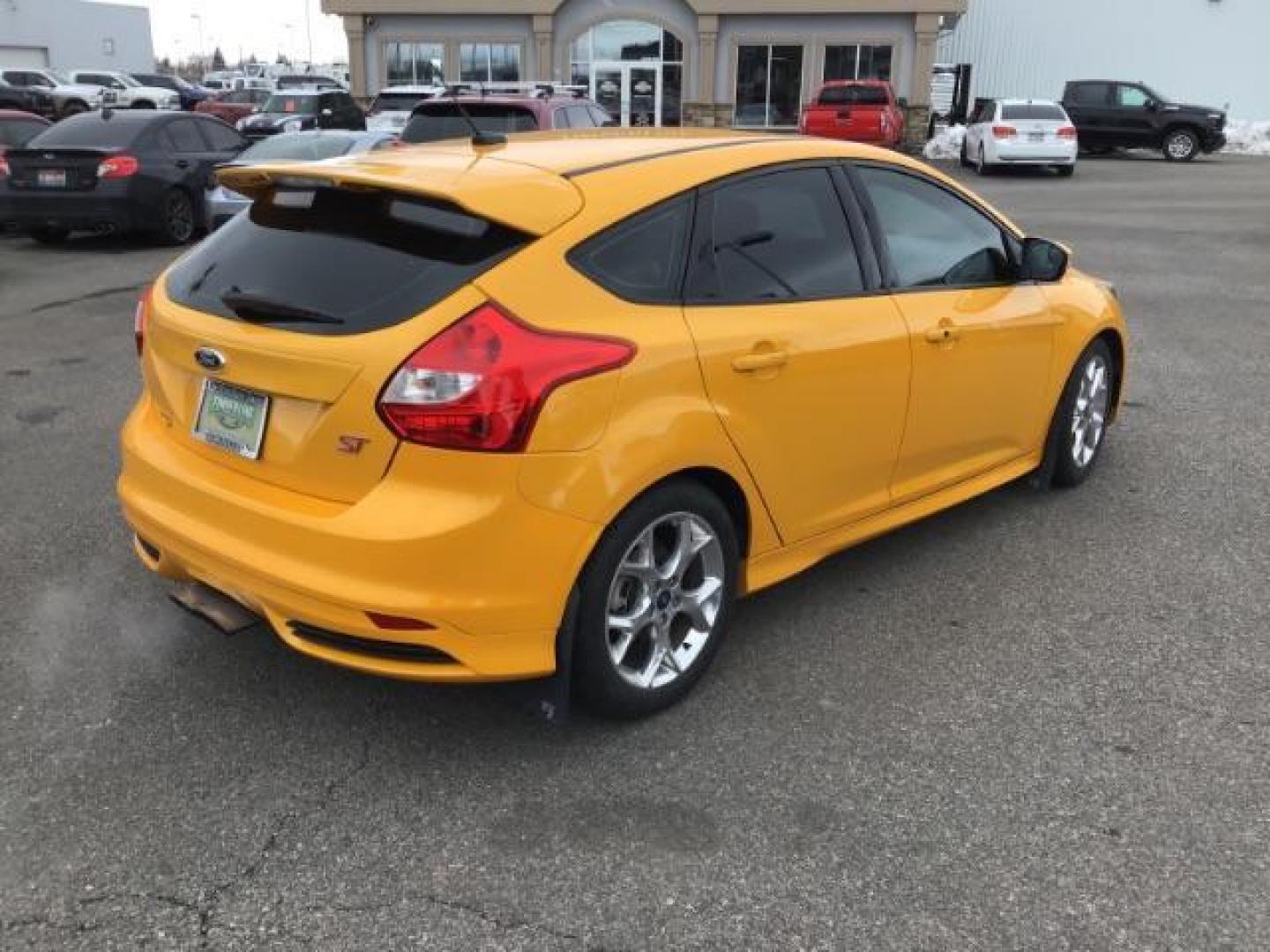 2014 YELLOW /Charcoal Black Ford Focus ST Hatch (1FADP3L96EL) with an 2.0L L4 DOHC 16V engine, 5-Speed Manual transmission, located at 1235 N Woodruff Ave., Idaho Falls, 83401, (208) 523-1053, 43.507172, -112.000488 - This 2014 Ford Focus ST, has 82,000 miles. It has a manual transmission. Comes with Leather interior, heated seats, sunroof, blue tooth audio, touch screen stereo, cruise control, power windows and locks. At Timberline Auto it is always easy to find a great deal on your next vehicle! Our experience - Photo#4