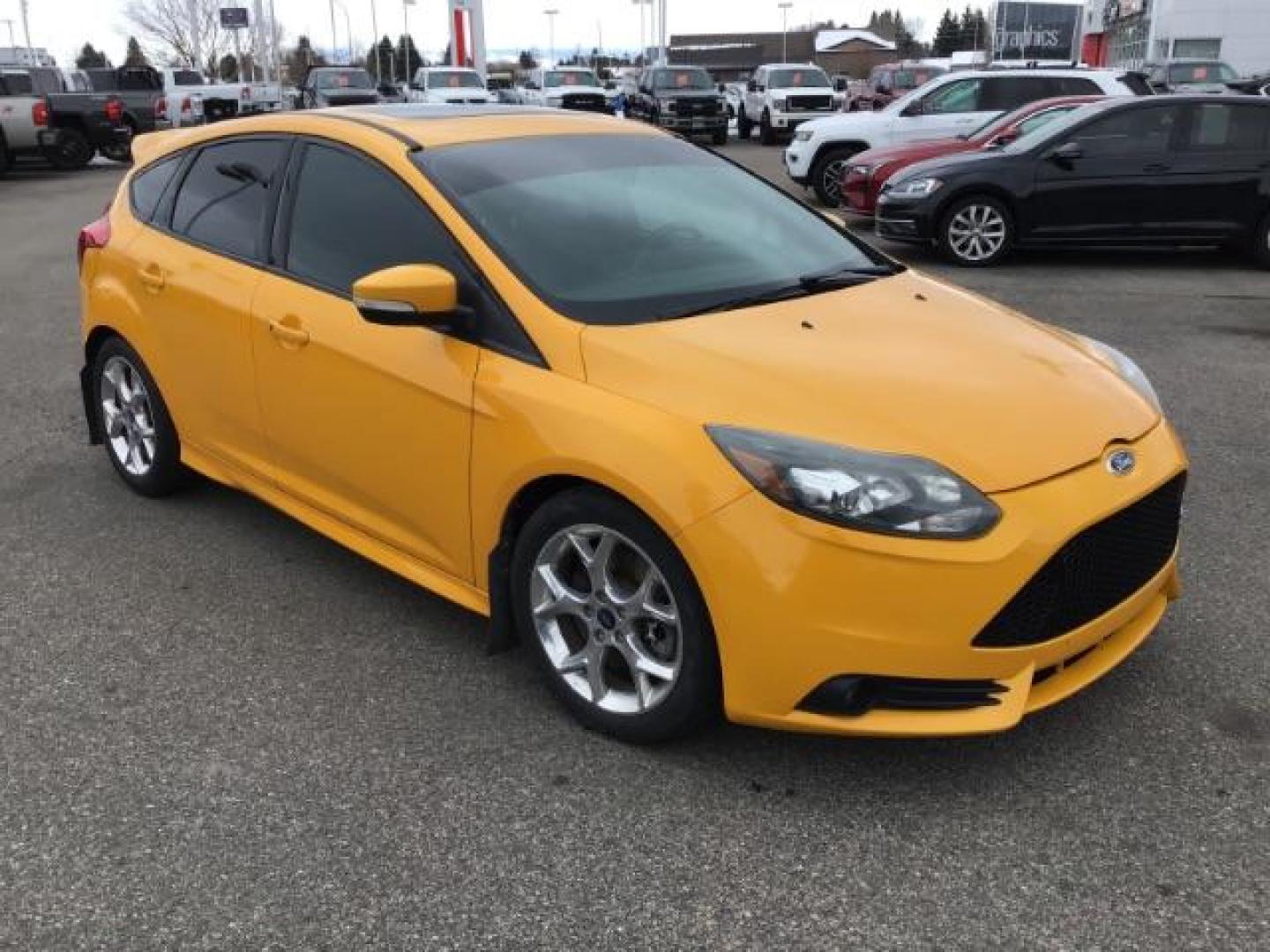 2014 YELLOW /Charcoal Black Ford Focus ST Hatch (1FADP3L96EL) with an 2.0L L4 DOHC 16V engine, 5-Speed Manual transmission, located at 1235 N Woodruff Ave., Idaho Falls, 83401, (208) 523-1053, 43.507172, -112.000488 - This 2014 Ford Focus ST, has 82,000 miles. It has a manual transmission. Comes with Leather interior, heated seats, sunroof, blue tooth audio, touch screen stereo, cruise control, power windows and locks. At Timberline Auto it is always easy to find a great deal on your next vehicle! Our experience - Photo#7