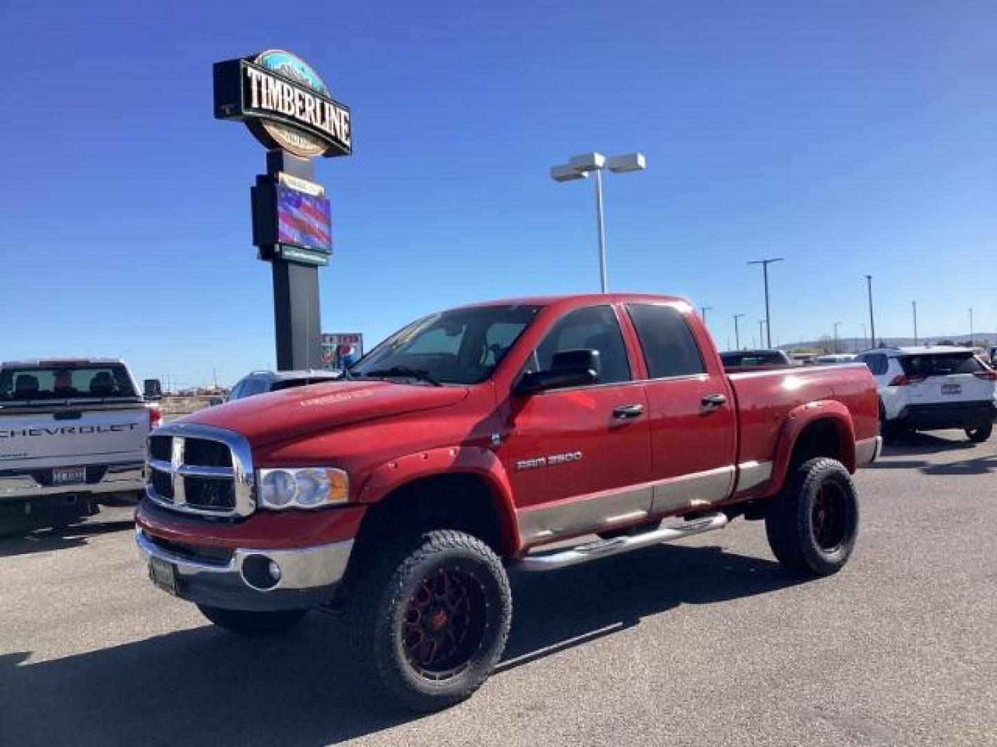 2004 Flame Red /Dark Slate Gray Leather Interior Dodge Ram 2500 SLT Quad Cab 4WD (3D7KU28CX4G) with an 5.9L L6 OHV 24V TURBO DIESEL engine, 5-Speed Automatic transmission, located at 1235 N Woodruff Ave., Idaho Falls, 83401, (208) 523-1053, 43.507172, -112.000488 - The 2004 Dodge Ram 2500 Quad Cab SLT Diesel is a robust and capable truck known for its towing capacity and durability. Here are some of the key features you might find on this model: Engine: Equipped with a powerful and torquey Cummins 5.9-liter inline-six turbocharged diesel engine, known for its - Photo#0